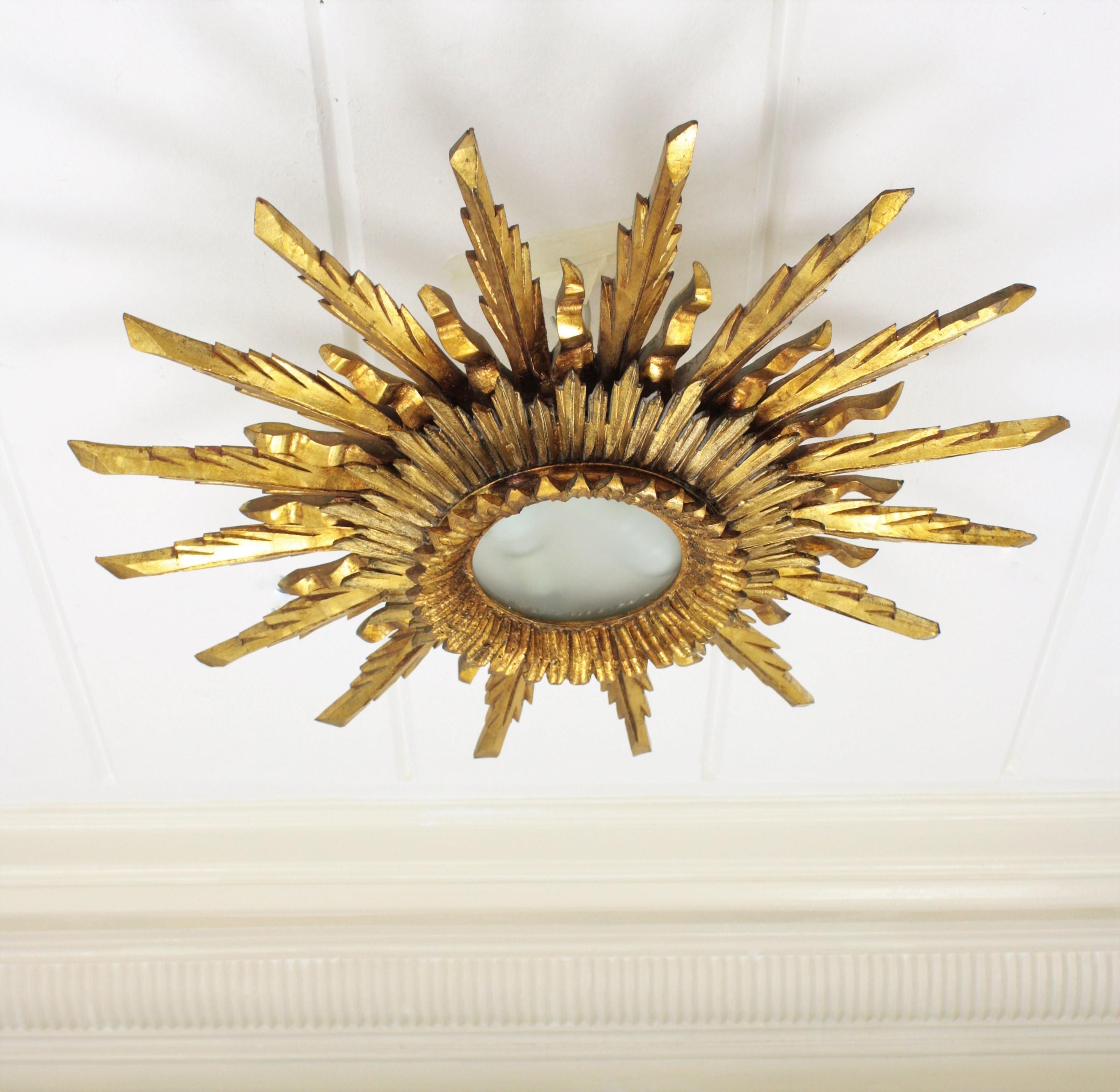 Mid-20th Century Large 1930s Baroque Gold Leaf Giltwood Sunburst Ceiling Light Fixture / Mirror