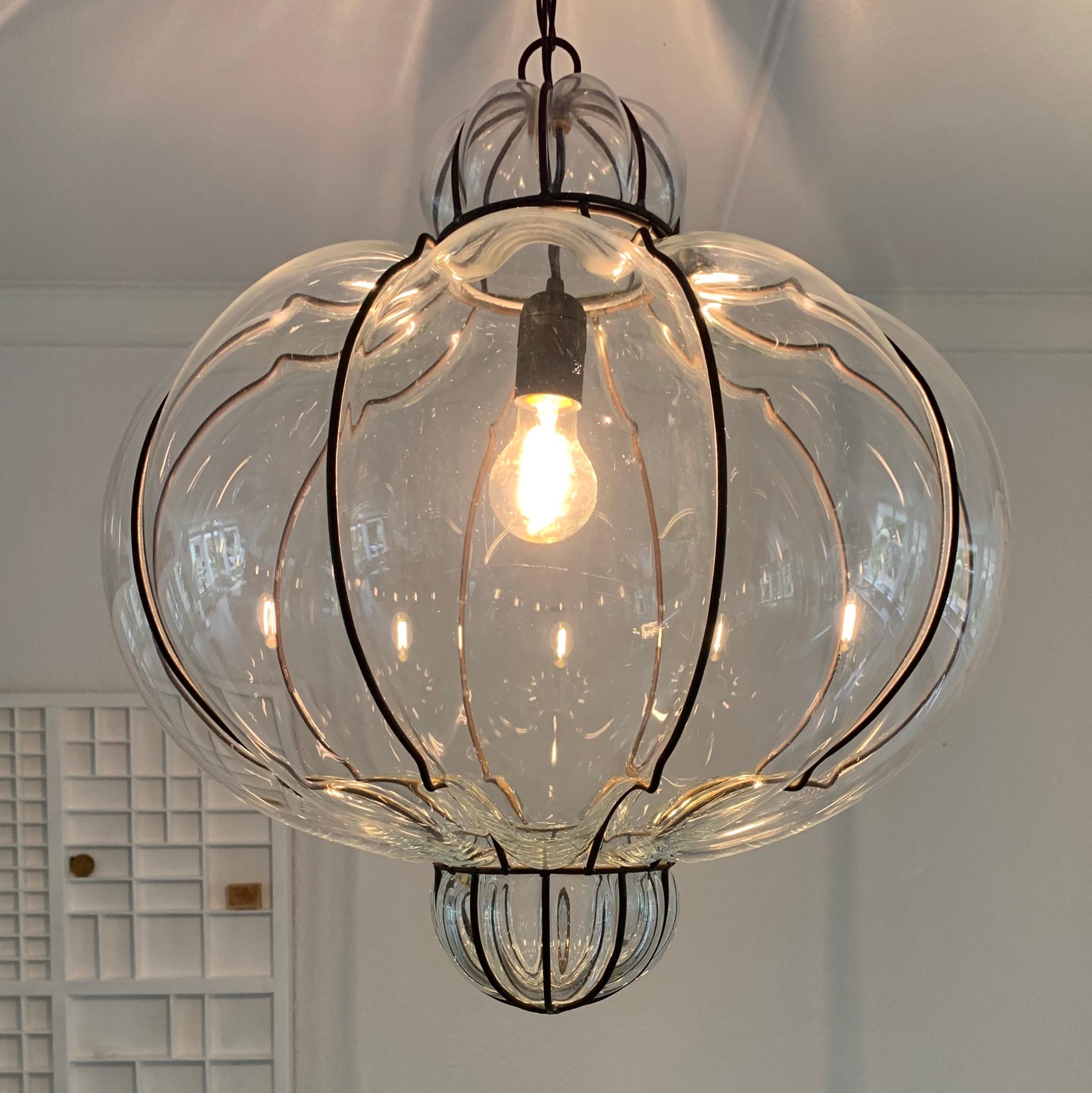 Stunning Midcentury made Italian transparent light fixture.

This fine quality workmanship pendant from mid-20th century Italy is another one of our recent great finds. Only three weeks ago did we come across his twin brother (jn terms of size and