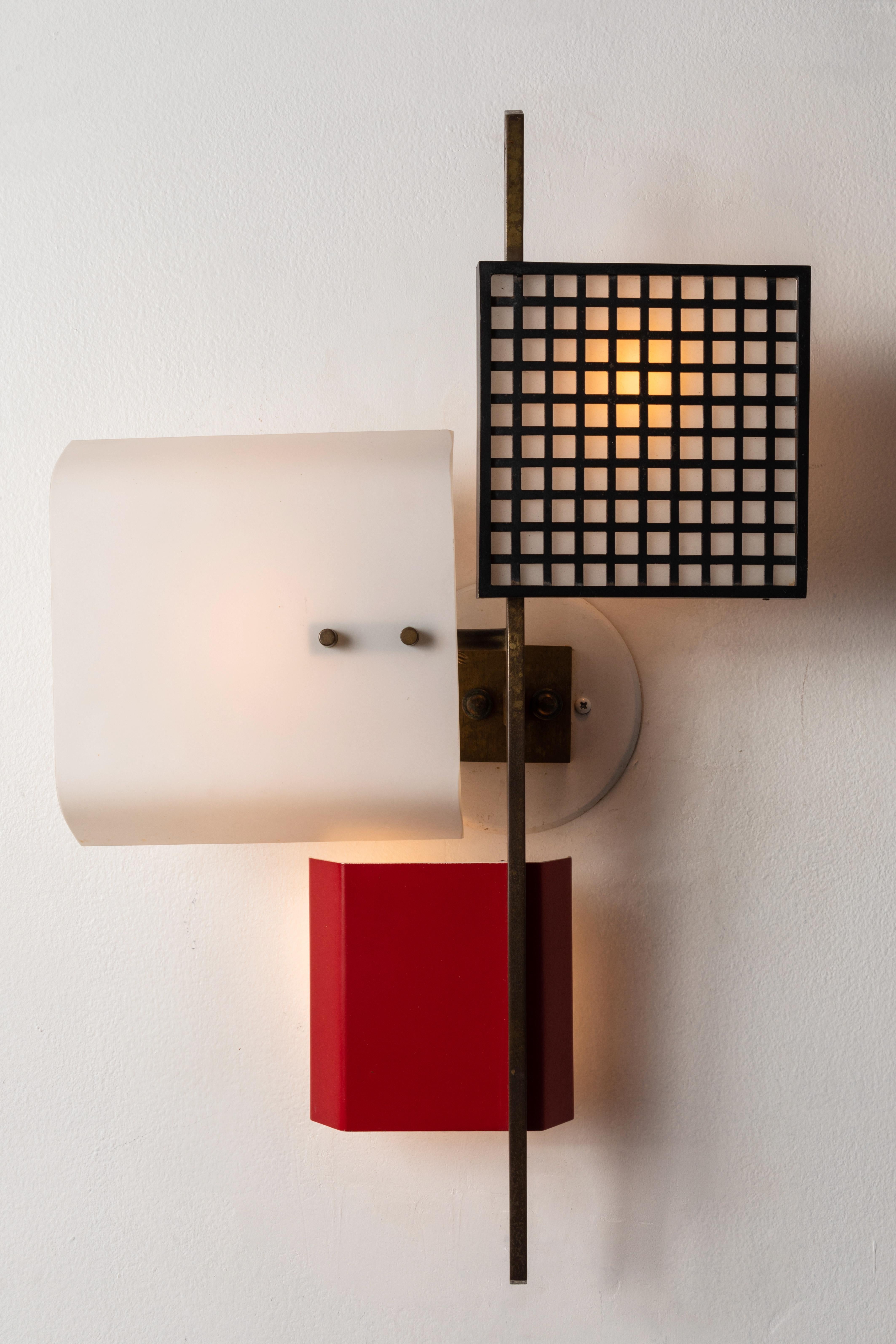 Large 1950s 3-panel wall light attributed to Oscar Torlasco executed in satin opaline glass, red painted metal and patinated brass. Professionally rewired for US electrical.  An exquisite sculptural lamp of incomparable refinement.

Lumi was one