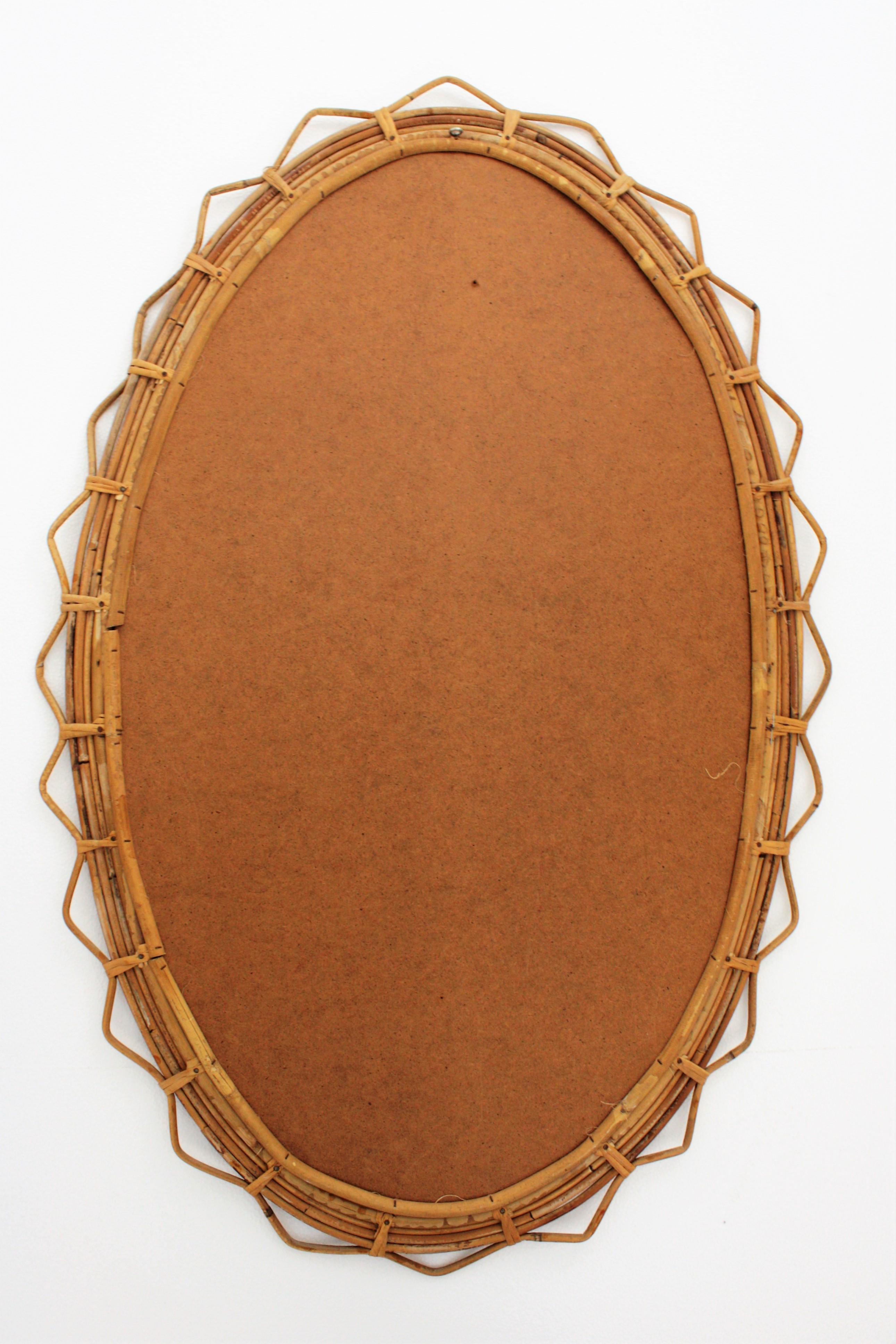Large 1950s French Riviera Bamboo and Rattan Jagged Edge Oval Sunburst Mirror 2
