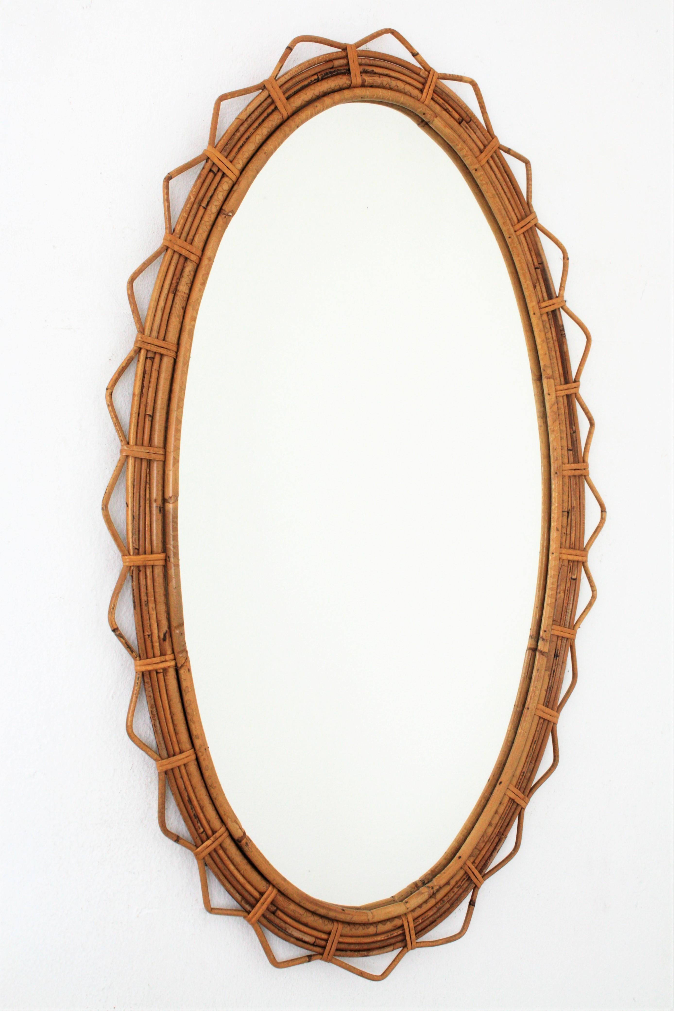 Mid-Century Modern Large 1950s French Riviera Bamboo and Rattan Jagged Edge Oval Sunburst Mirror
