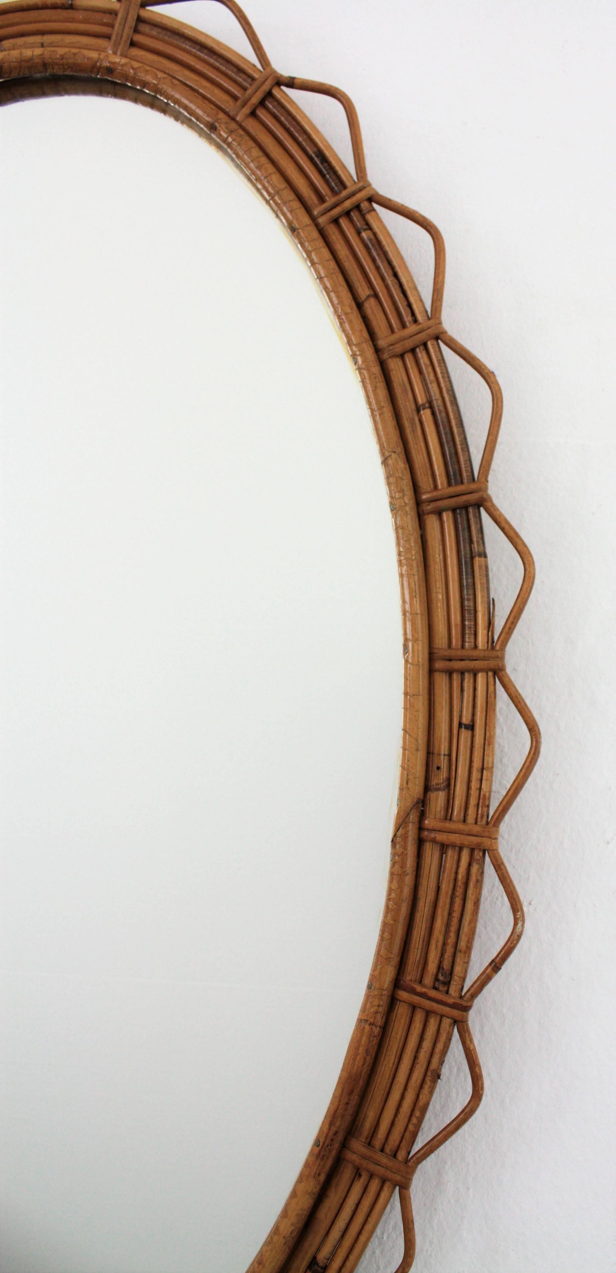 20th Century Large 1950s French Riviera Bamboo and Rattan Jagged Edge Oval Sunburst Mirror