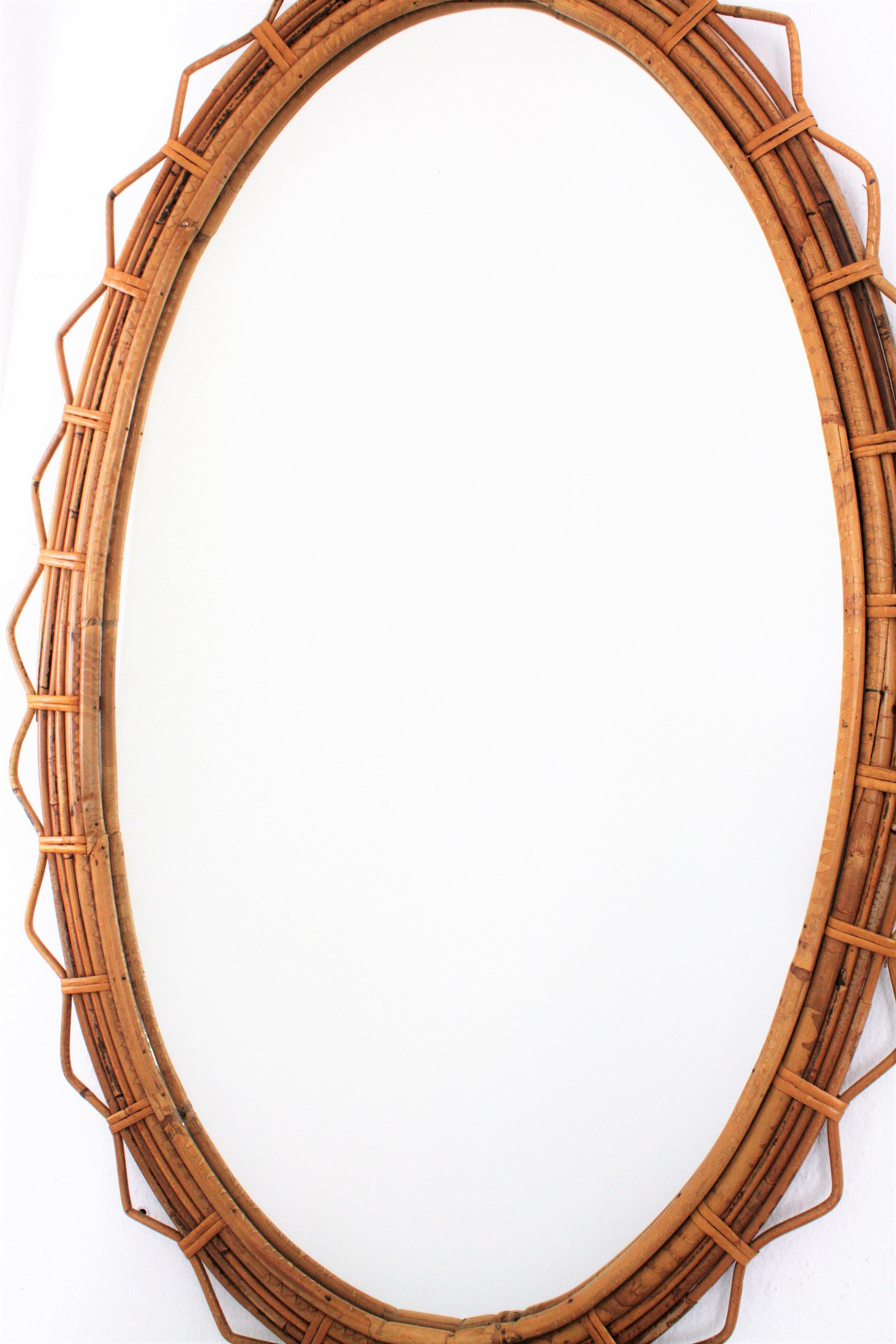 Large 1950s French Riviera Bamboo and Rattan Jagged Edge Oval Sunburst Mirror In Excellent Condition In Barcelona, ES