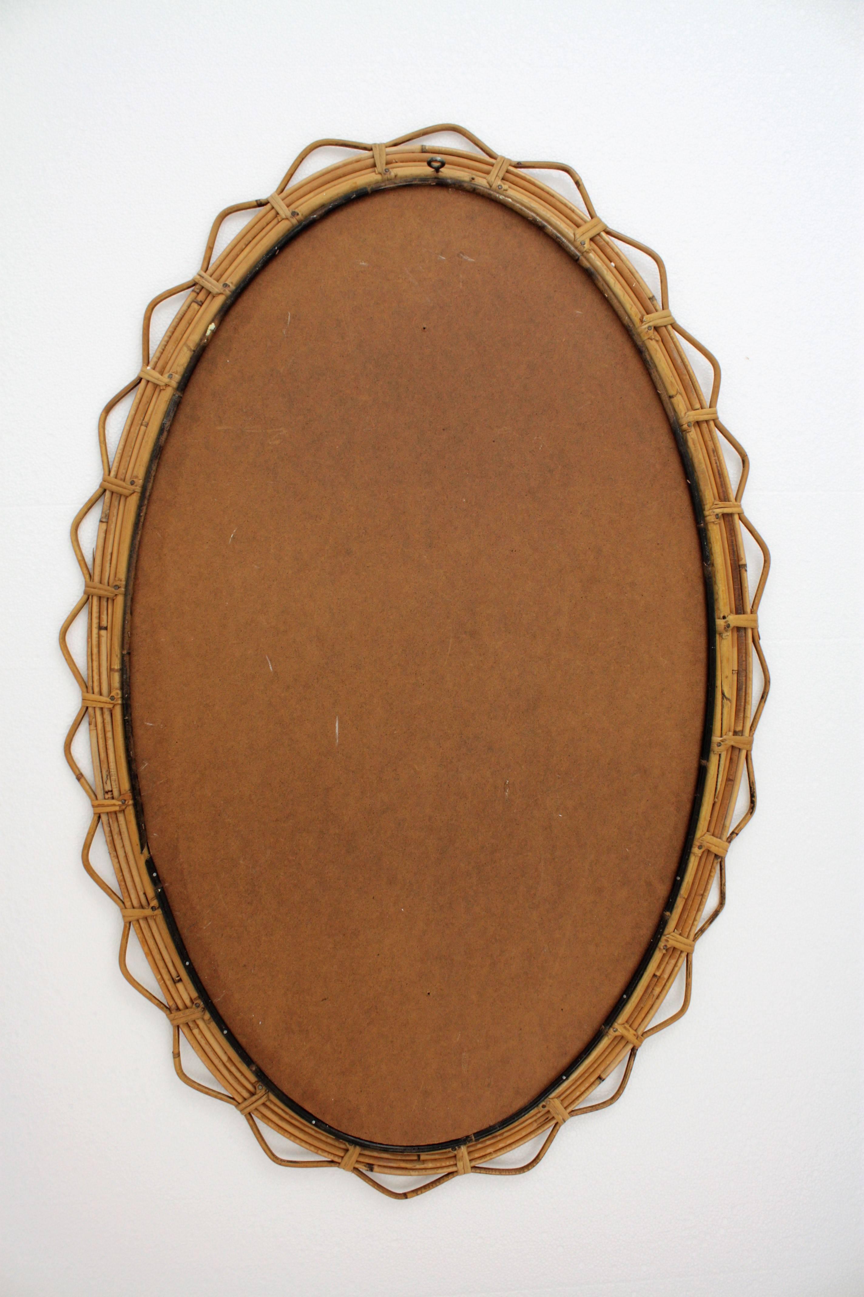 Large 1950s French Riviera Bamboo and Rattan Jagged Edge Oval Sunburst Mirror 1
