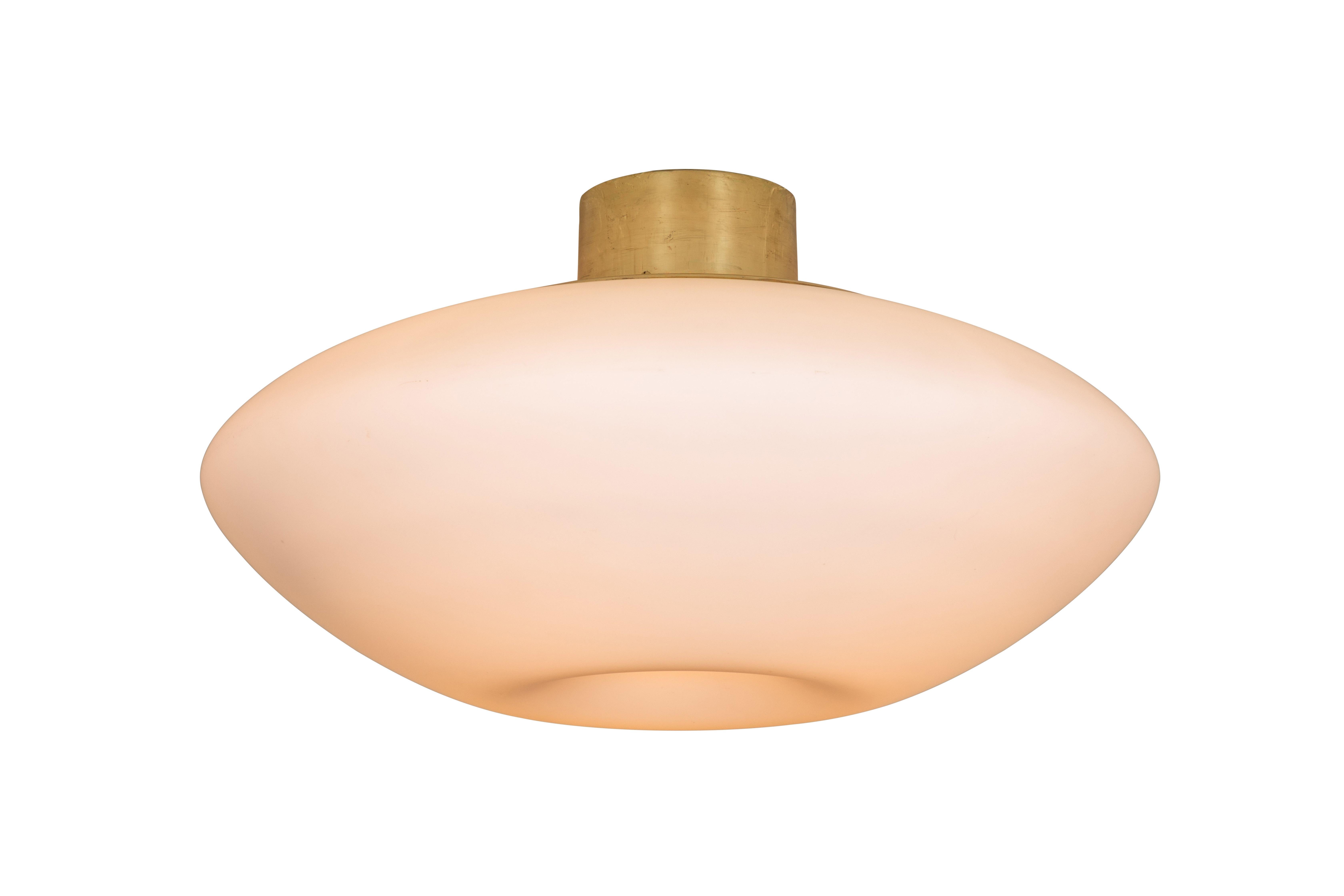 Large 1950s Lisa Johansson-Pape glass and brass ceiling lamp for Orno. Executed in blown opaline glass and brass. Manufactured by Orno Oy, Finland. Stamped with manufacturer's mark.
 
Not UL listed, but available from authorized 3rd party vendor