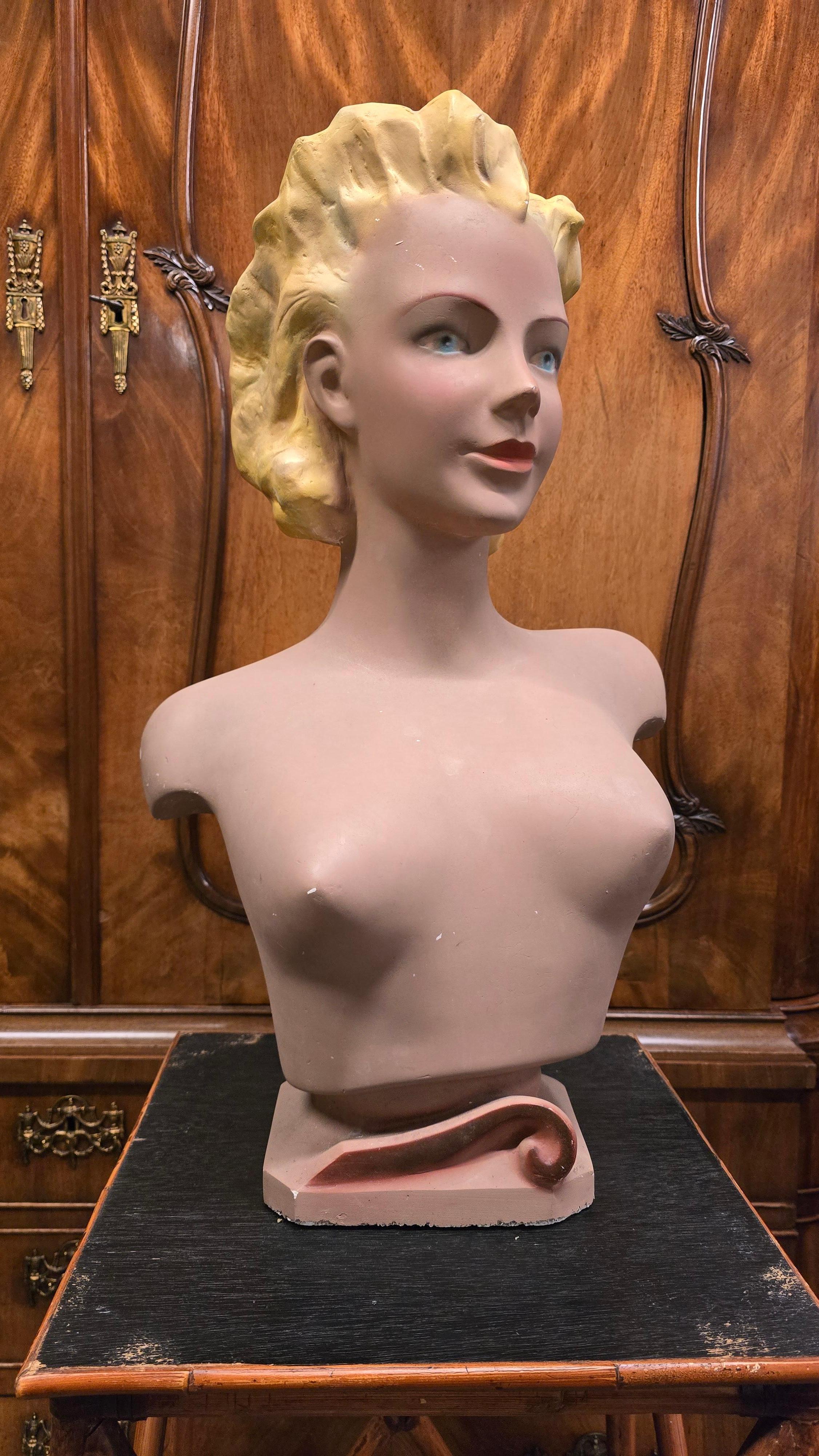 Large 1950s Novita Plaster Bust – Art Deco / Hollywood Regency Mannequin Display

This impressive vintage plaster bust was produced in France during the 1940s–1950s by Novita. The sculpture depicts a glamorous young woman with blonde hair and