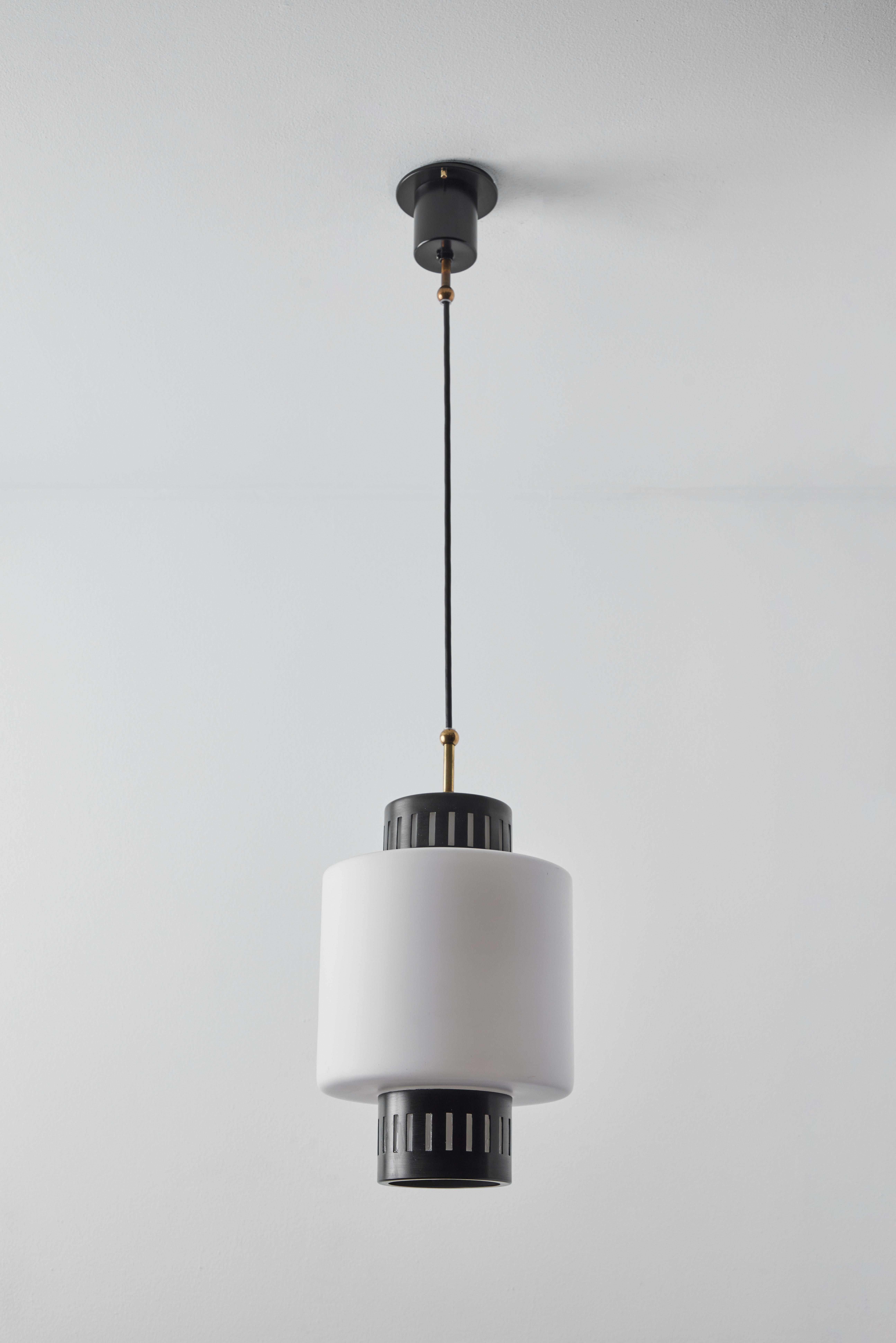 Large 1950s Stilnovo glass and metal pendant. A quintessentially 1950s Italian design executed in matte finish opaline glass and painted metal with a custom fabricated architectural ceiling canopy for mounting over a standard American J-box. A