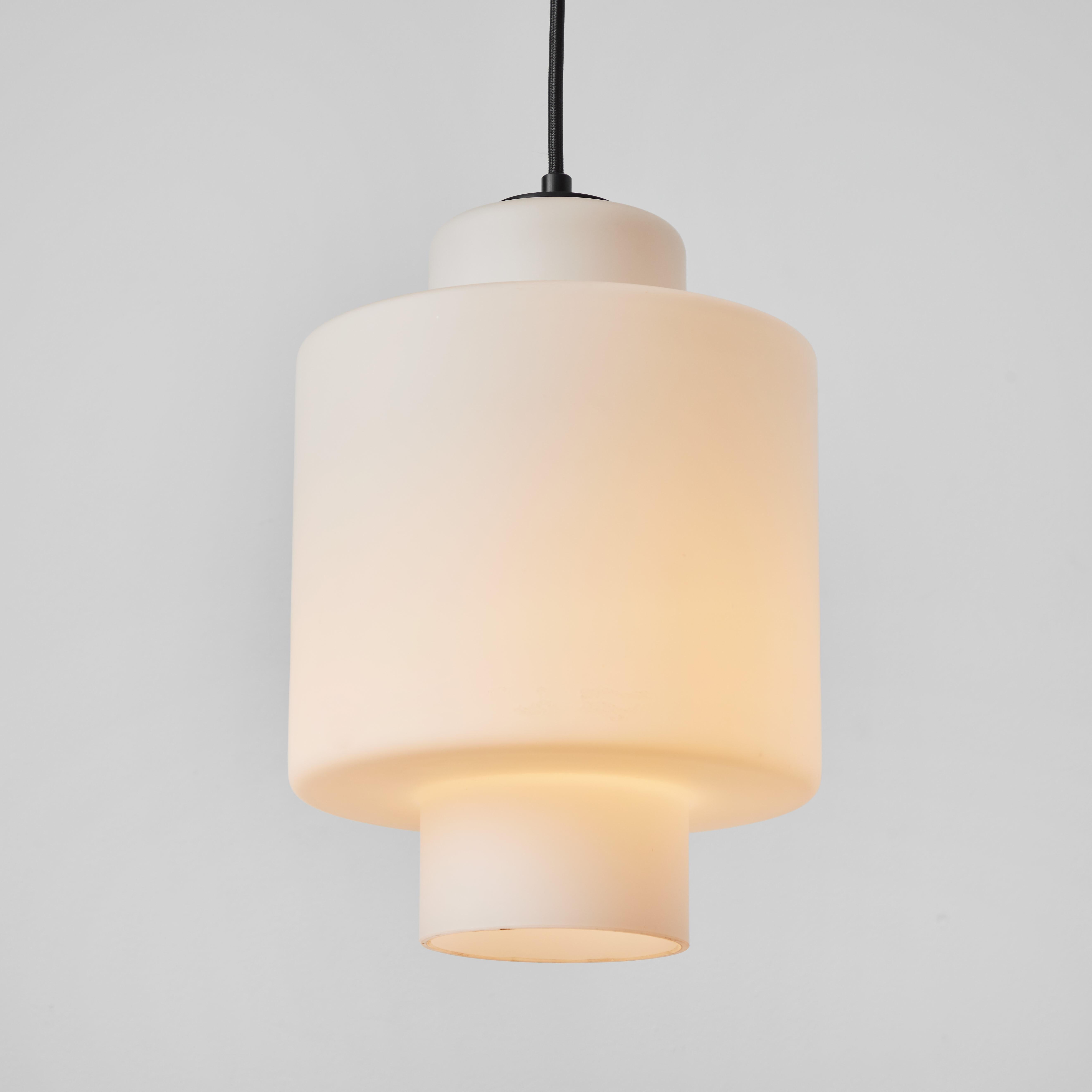 1960s Stilnovo Model #2120/1 Sculptural Opaline Glass Pendant.

Executed in matte finish opaline glass and painted metal with a custom fabricated period style ceiling plate for mounting over a standard American J-box. A highly functional light
