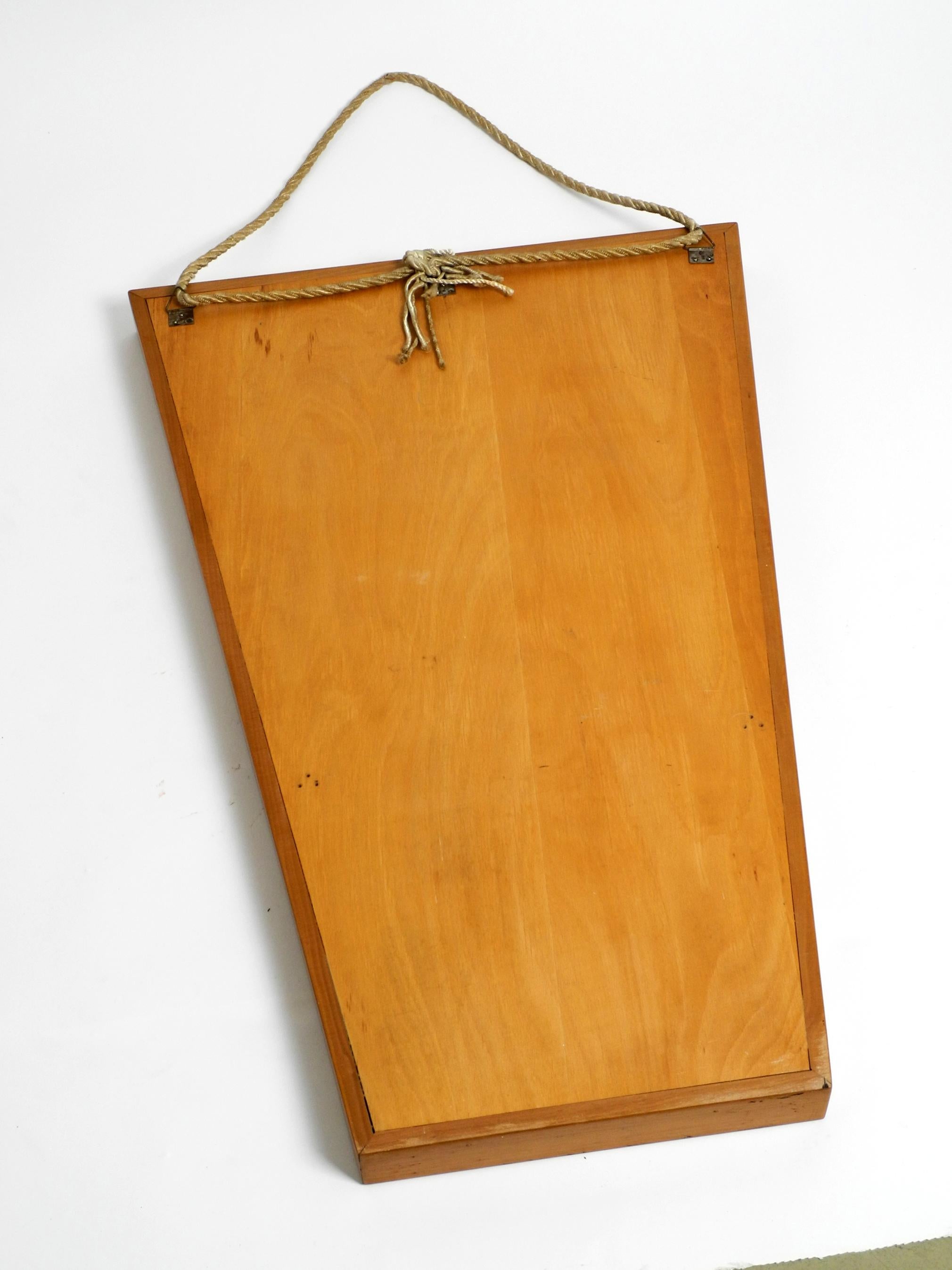 Large 1950s wall mirror in trapezoidal shape with a solid cherry wood frame For Sale 4