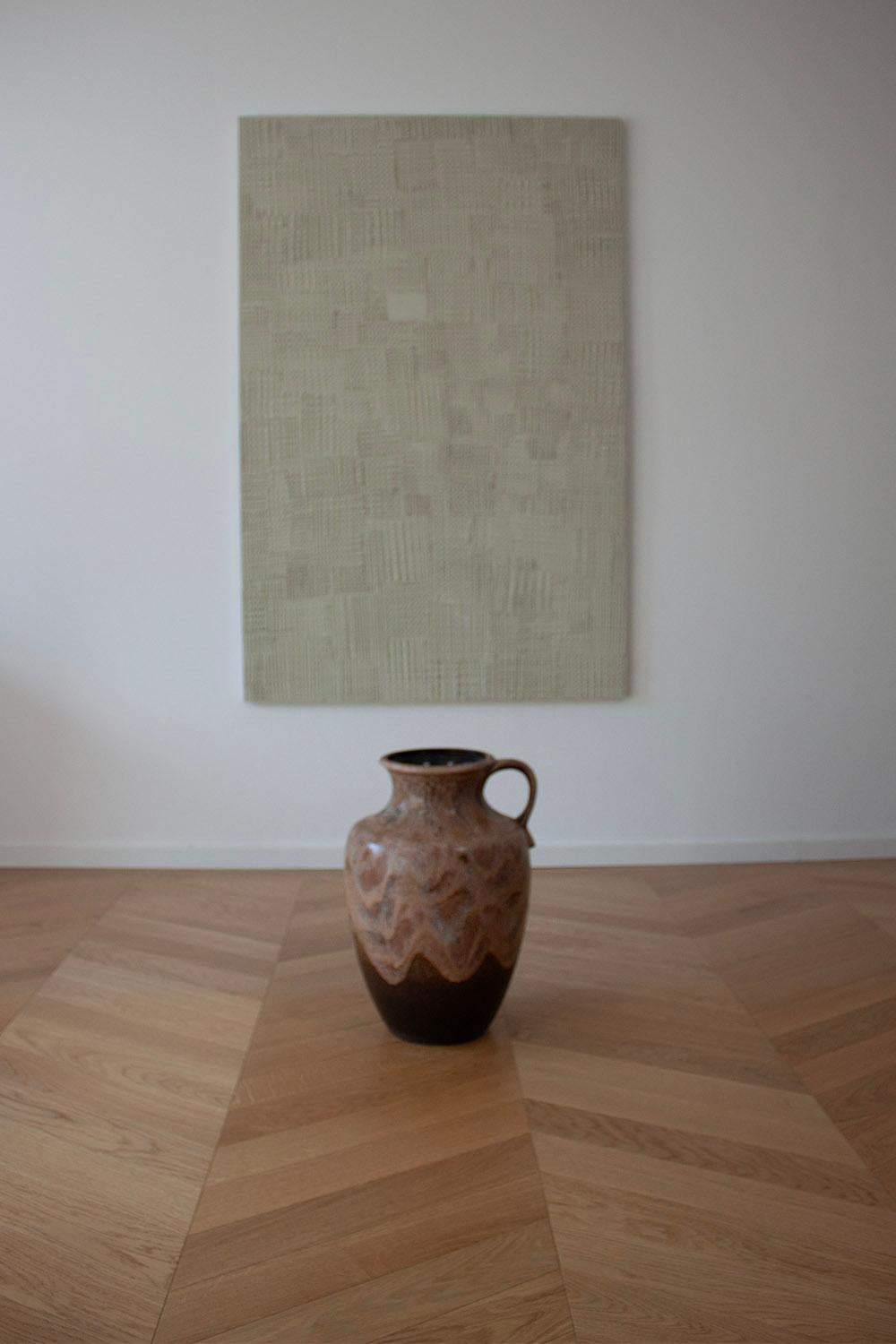 This Dümler & Breiden ceramic floor or branch vase is a great example of the 1960-1970 German ceramic design style. This style is recognized through its brutalist influence combined with modern organic shapes. This large ceramic floor vase is the
