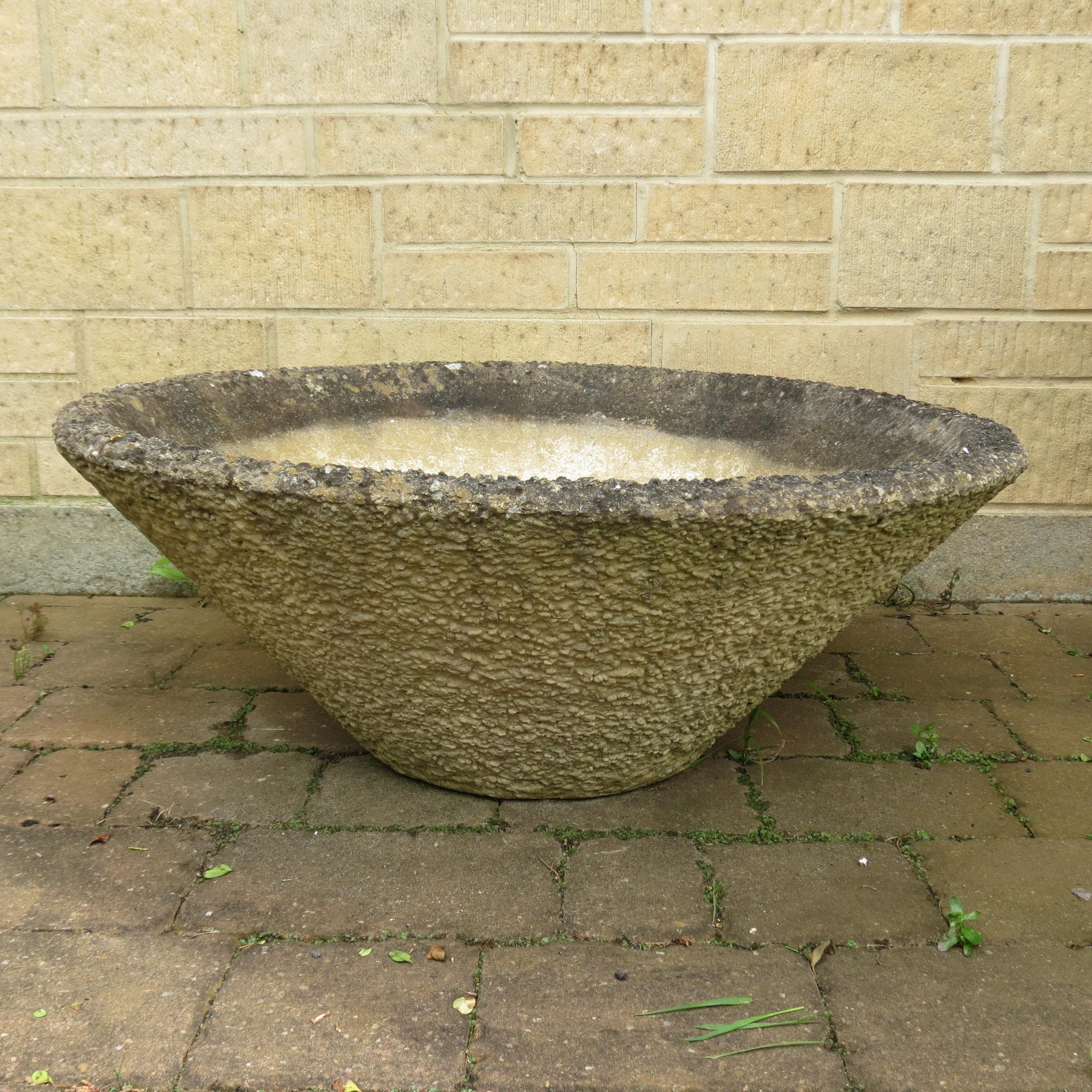 Large concrete garden planter from the 1960s or 1970s. Very good quality, heavy planter made from reinforced concrete.  In good vintage condition, some wear over all and very nicely patinated. Smooth exterior to the pot. 


77cm diameter 29cm tall