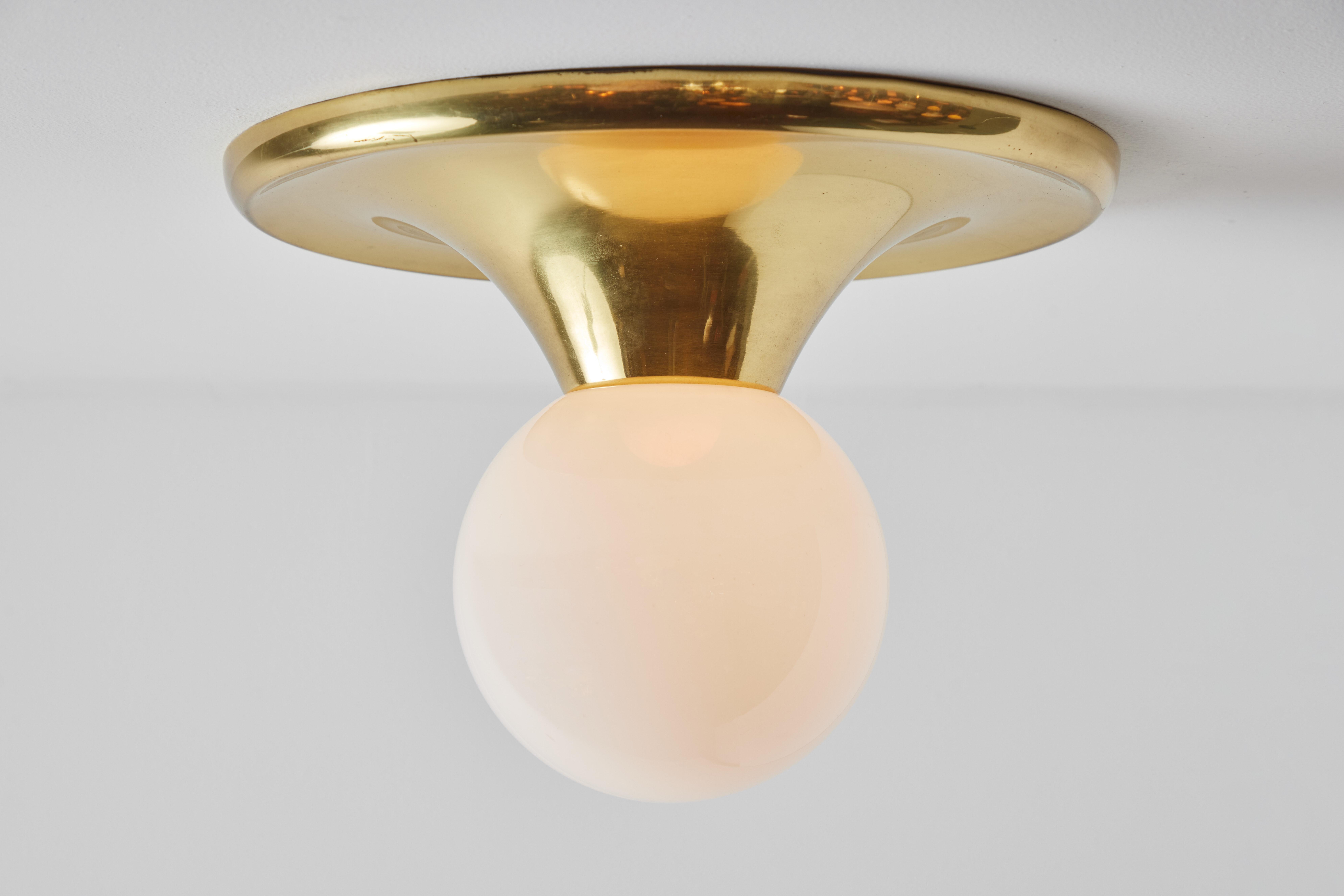 1960s Achille Castiglioni 'light ball' wall or ceiling lamp for Flos. Designed in 1965, this rare and vintage brass variant comes with satin opaque glass. An incredibly refined and iconic midcentury design that is quintessentially Italian. Retains