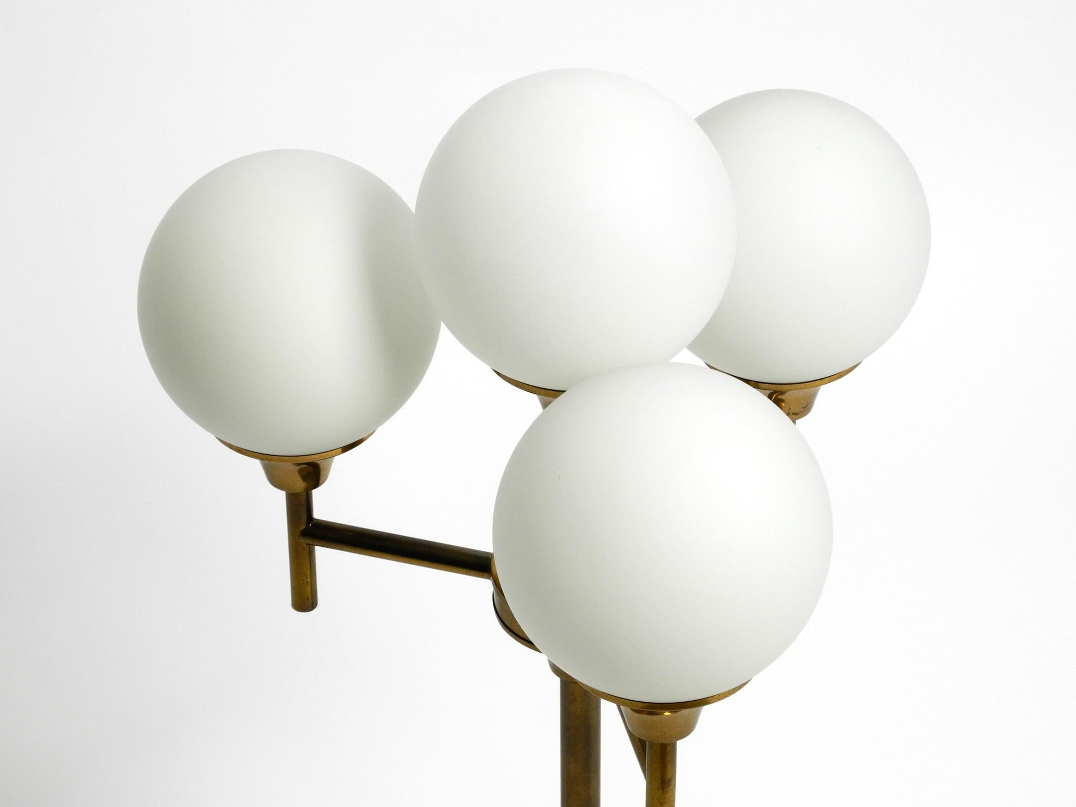 Large 1960s brass table or floor lamp with 4 glass spheres by Kaiser Leuchten For Sale 9