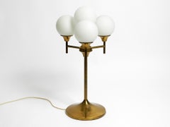 Large 1960s brass table or floor lamp with 4 glass spheres by Kaiser Leuchten