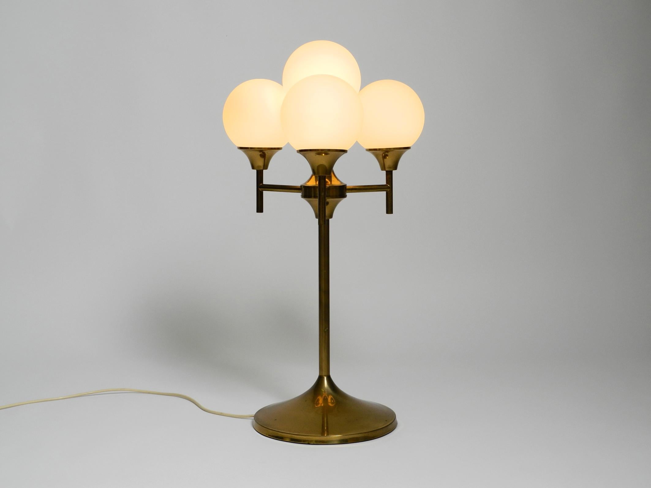 Mid-Century Modern Large 1960s brass table or floor lamp with 4 glass spheres by Kaiser Leuchten For Sale