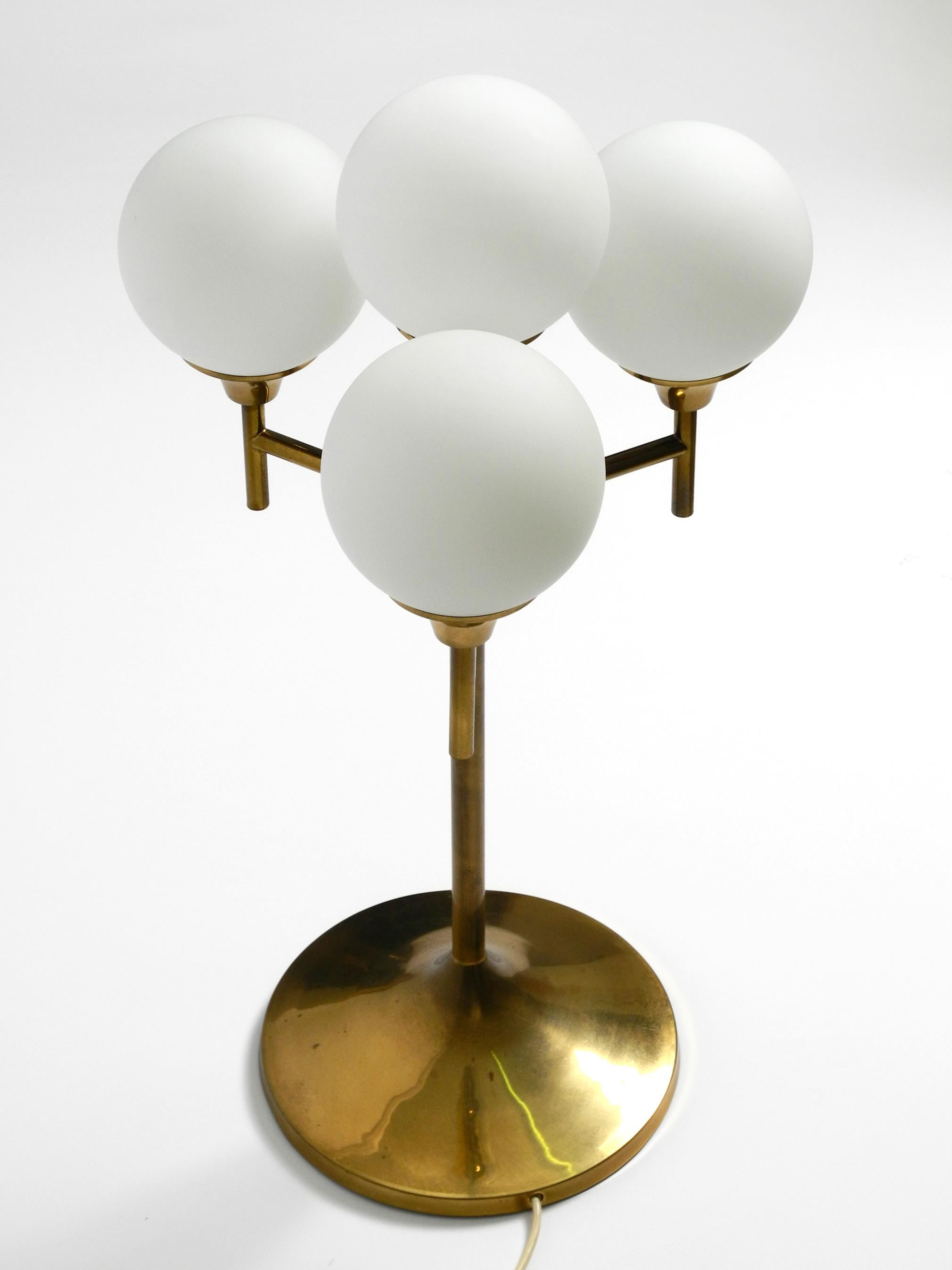 Mid-20th Century Large 1960s brass table or floor lamp with 4 glass spheres by Kaiser Leuchten For Sale