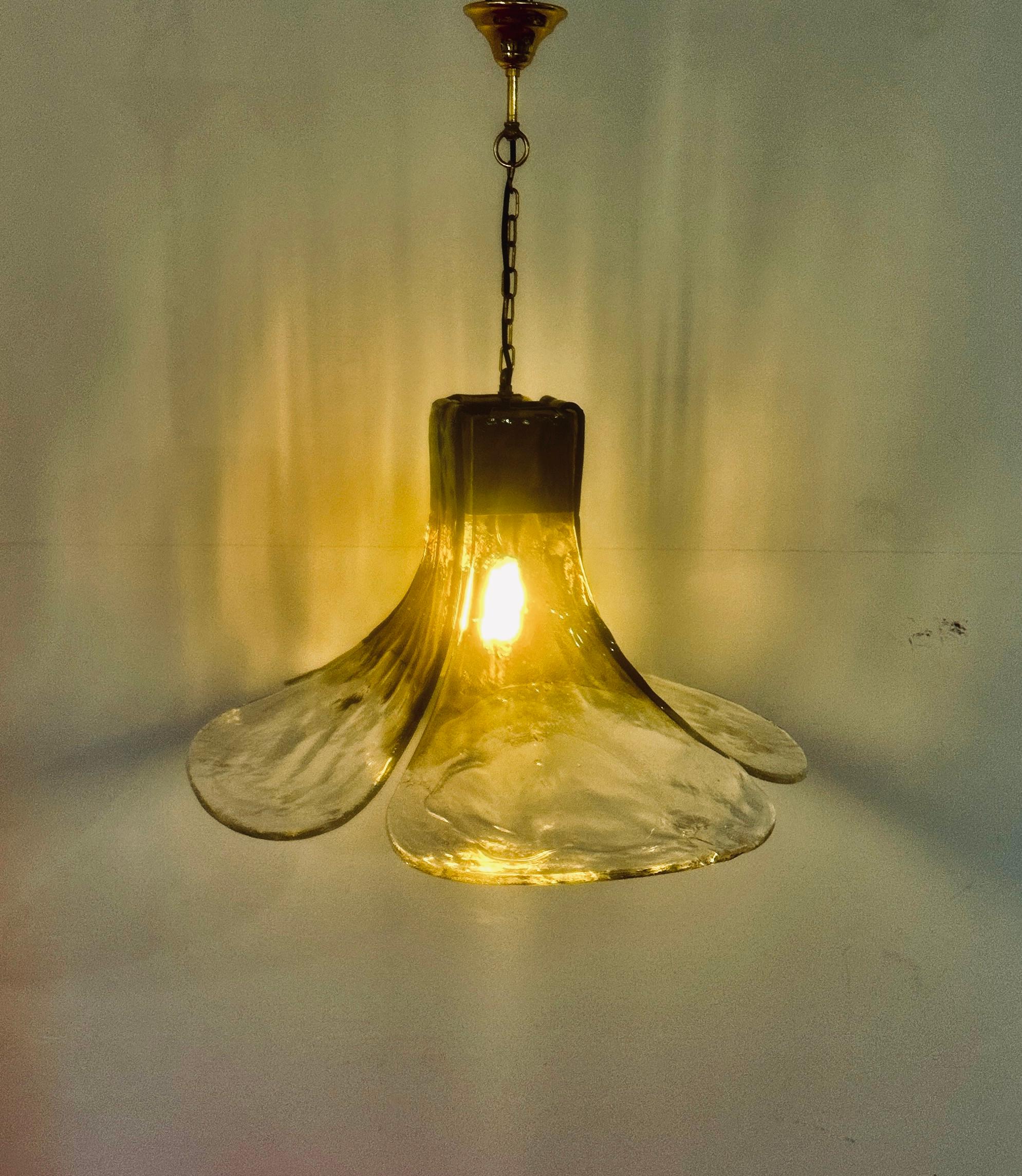 A stunning and eye-catching chandelier which captures a different carefree era with its retro four glass petal 