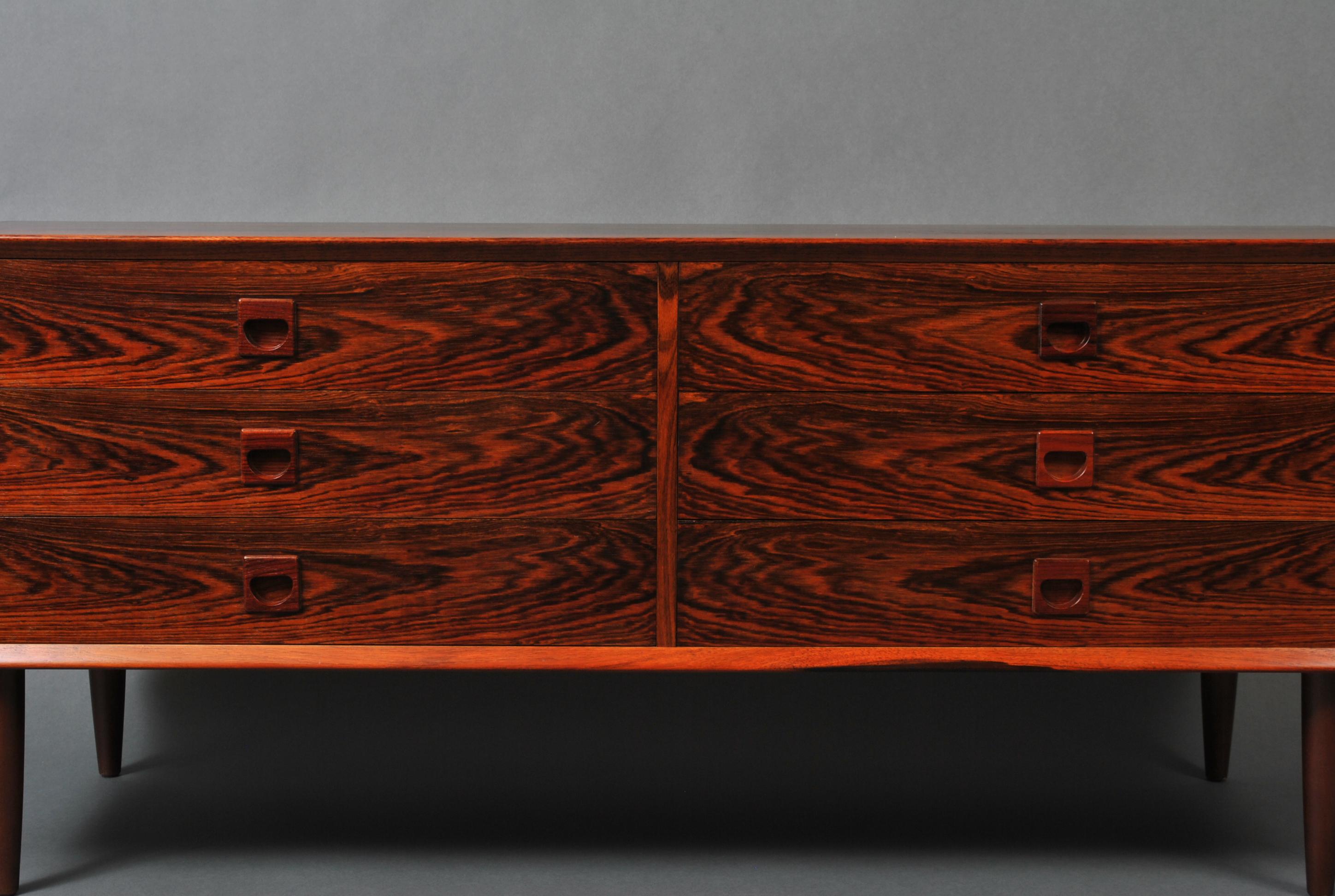 A large midcentury Danish chest of drawers. Very nice scale proportions. Wonderful color tone and figuring.