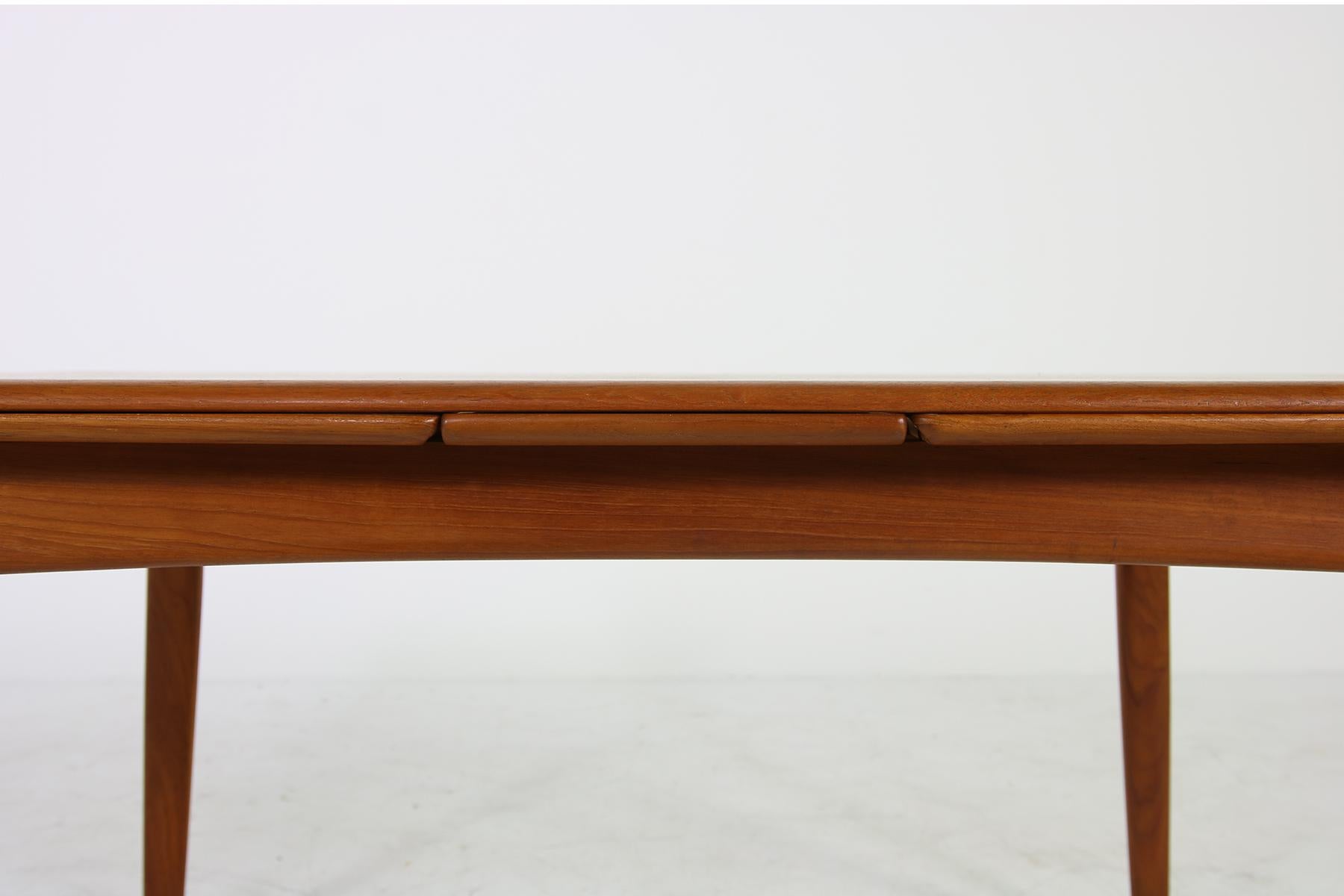 Beautiful 1960s Danish modern dining table, designed by Svend Aage Madsen, made in Denmark, manufactured by K. Knudsen & Son, beautiful table in a fantastic condition, amazing teak wood, extendable. Signed underneath. Measurements 145 x 85 cm 72 cm