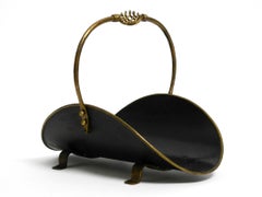 Large 1960s firewood stand made of heavy metal and brass