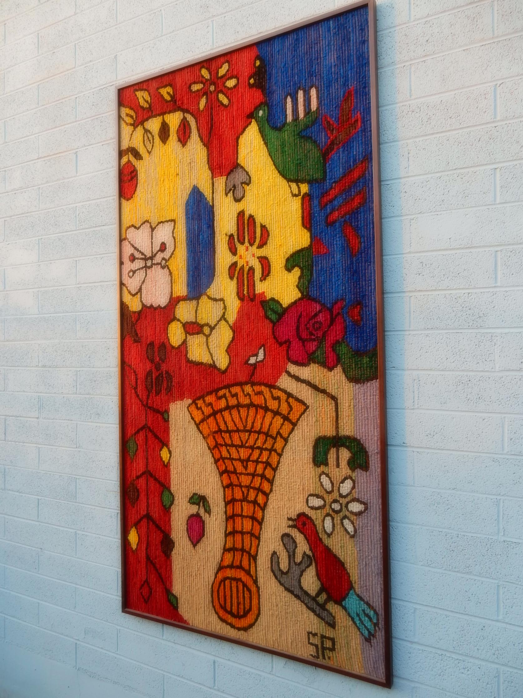 Magnificent 6 foot x 3 foot brightly colored wool woven tapestry
professionally framed in birchwood.
Surreal flowers, fruit and birds in gorgeous primary colors.
Signed S.P.