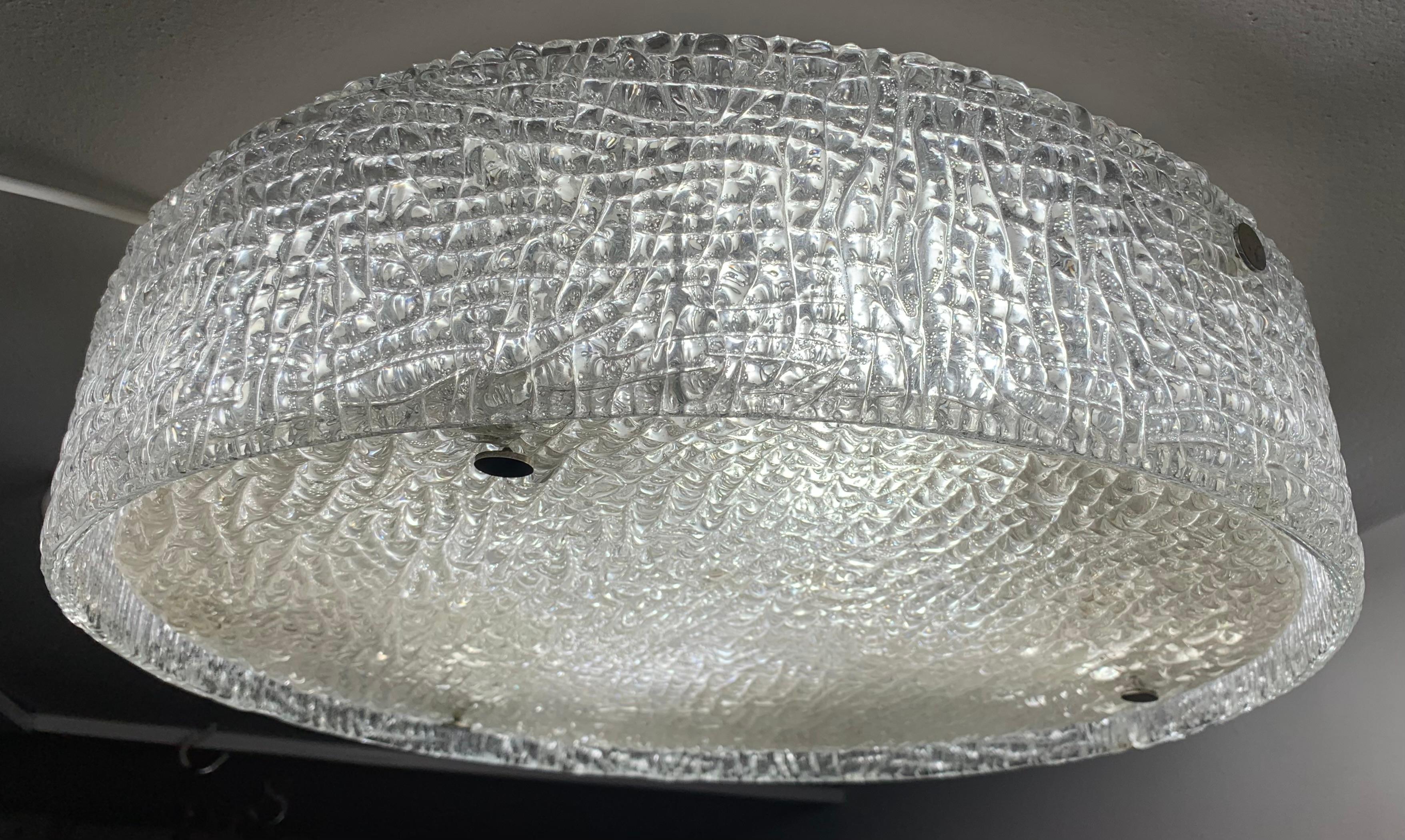 Large 1960s German Kaiser Leuchten textured, iced-glass, flush mount ceiling light. The thick textured glass circular base plate is mounted onto the white frame with three chrome screws which secure it in place. The light-bulbs can be accessed by