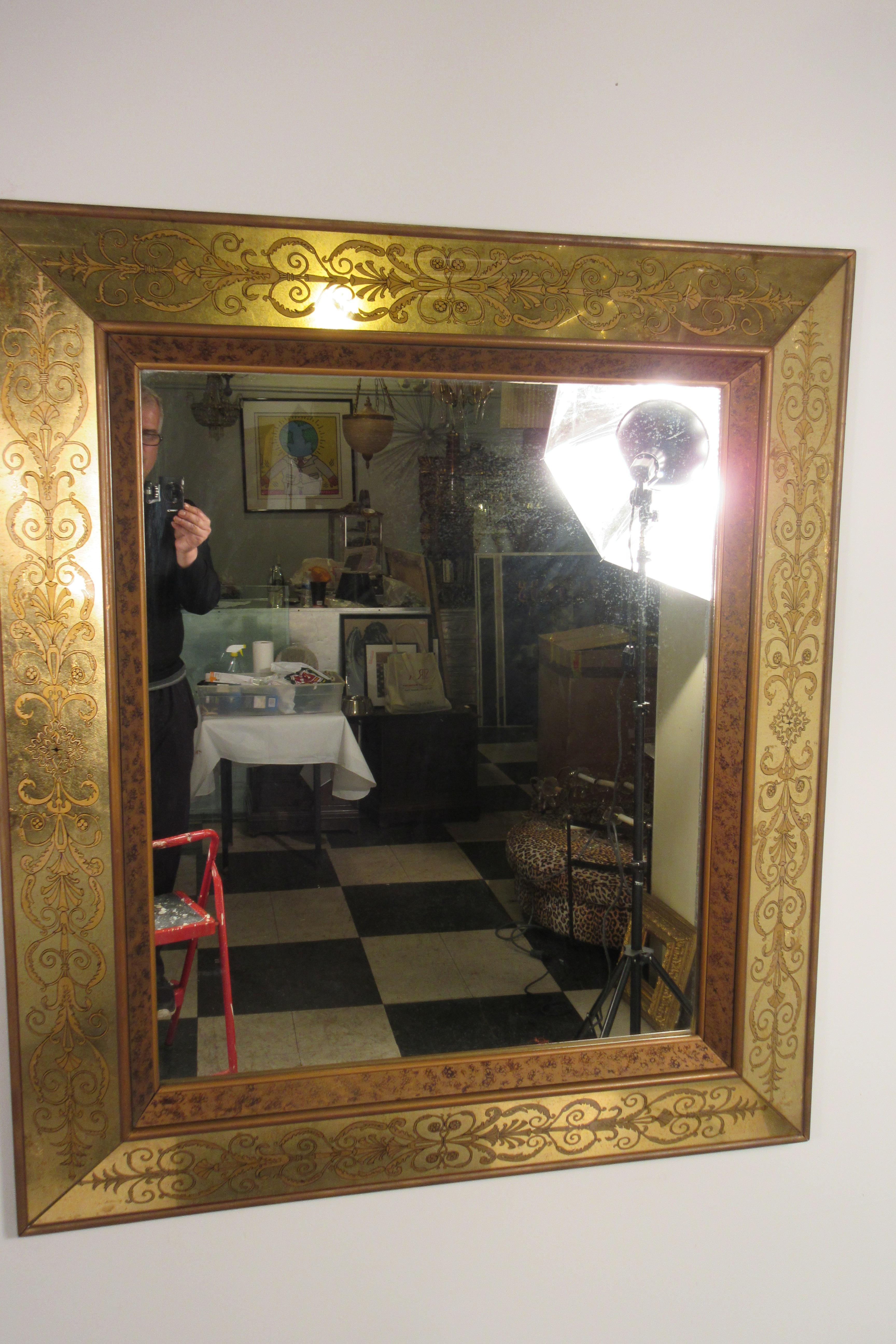 Large 1960s Italian églomisé mirror. Hand painted and gilded.