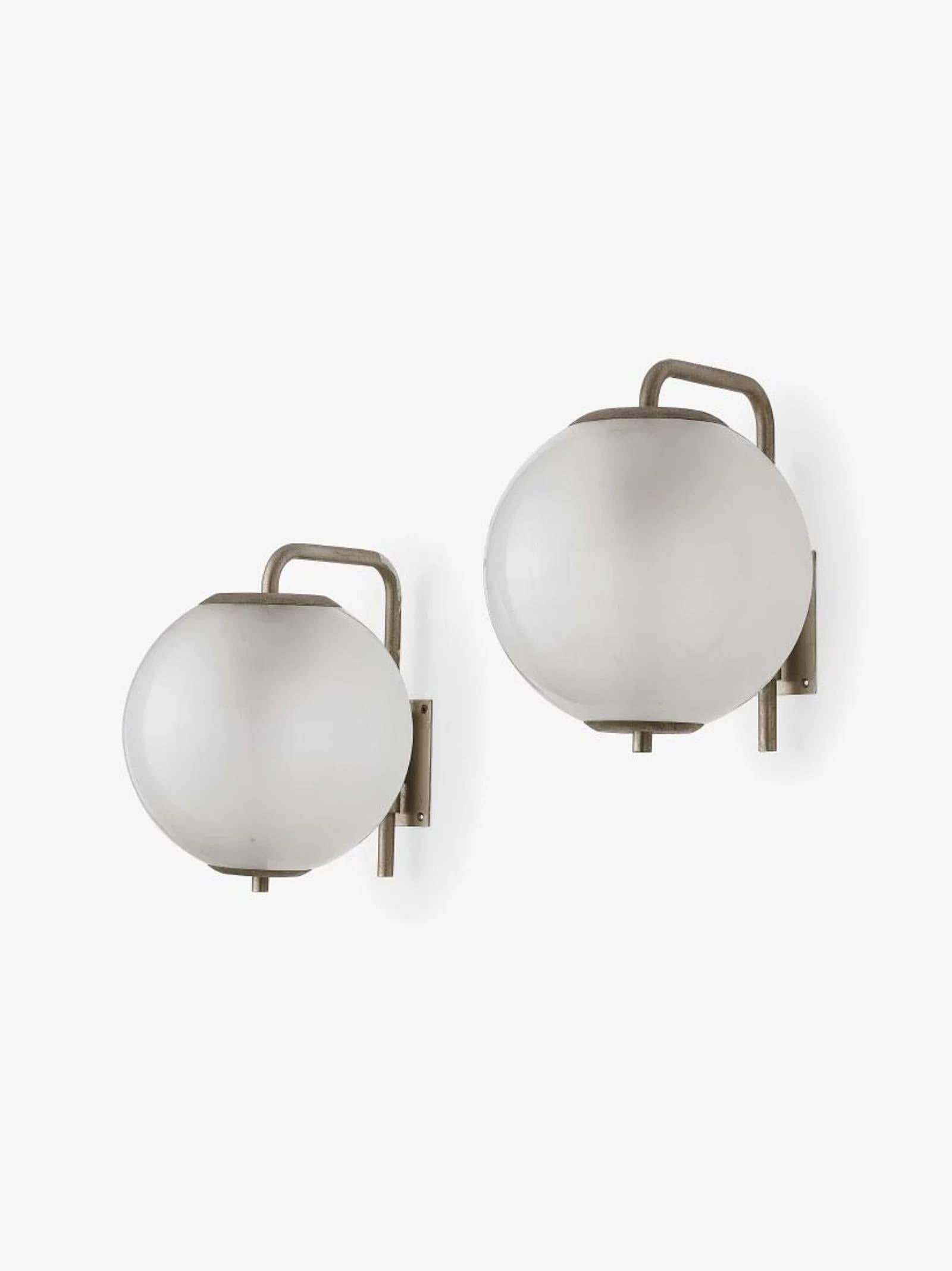 Large 1960s Italian glass globe sconces in the manner of Azucena. Executed in nickelled brass and opaline glass. A sculptural and refined design characteristic of the 1960s Italian designs of Azucena and Artemide.

Professionally rewired for US