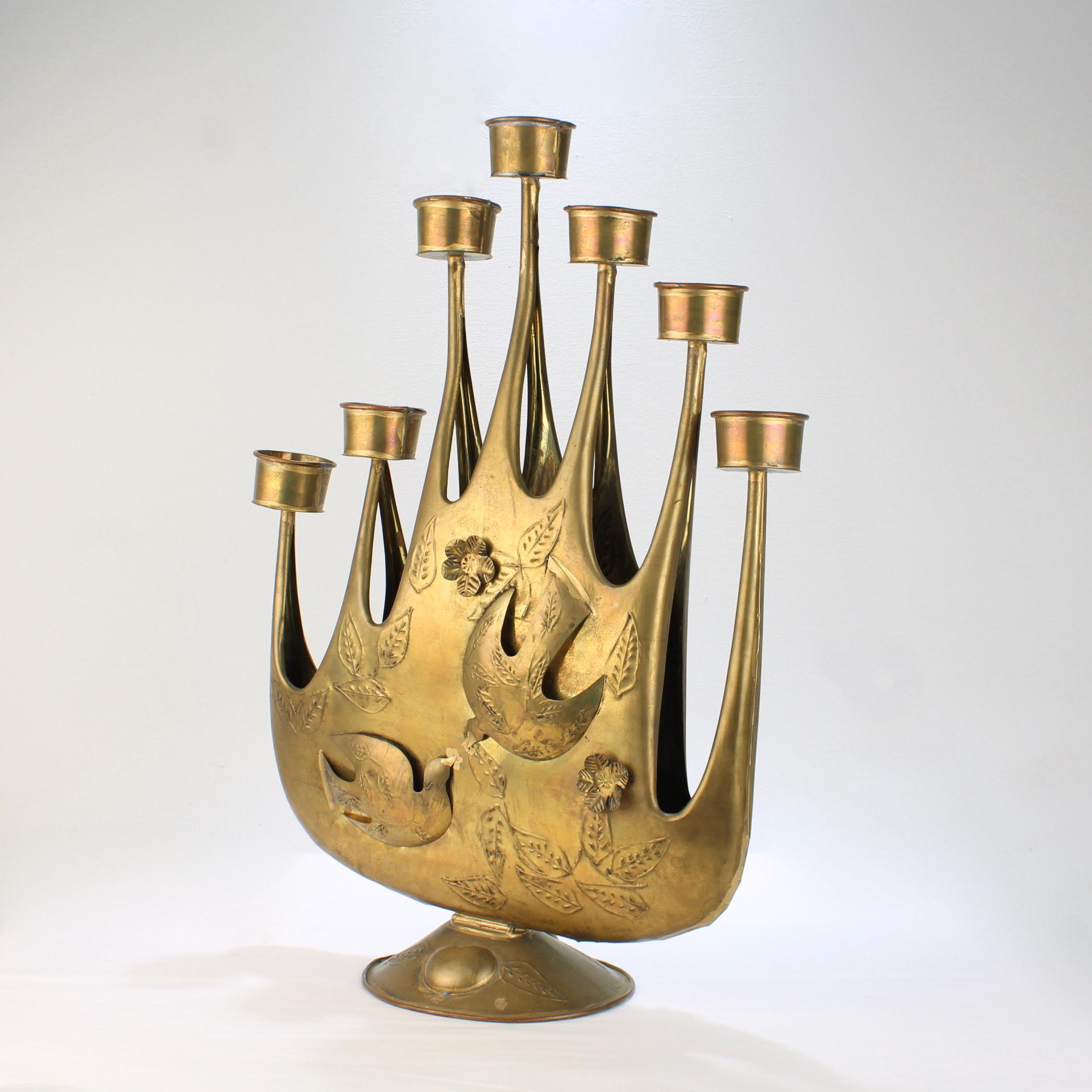 A wonderful, large-scale Mid-Century Mexican tin candelabrum or candle holder by Gene Bryon.

Gene Byron was a Canadian artist, who emigrated to Mexico and rose to prominence for her design and metalwork in the Mid-20th century. After her death,