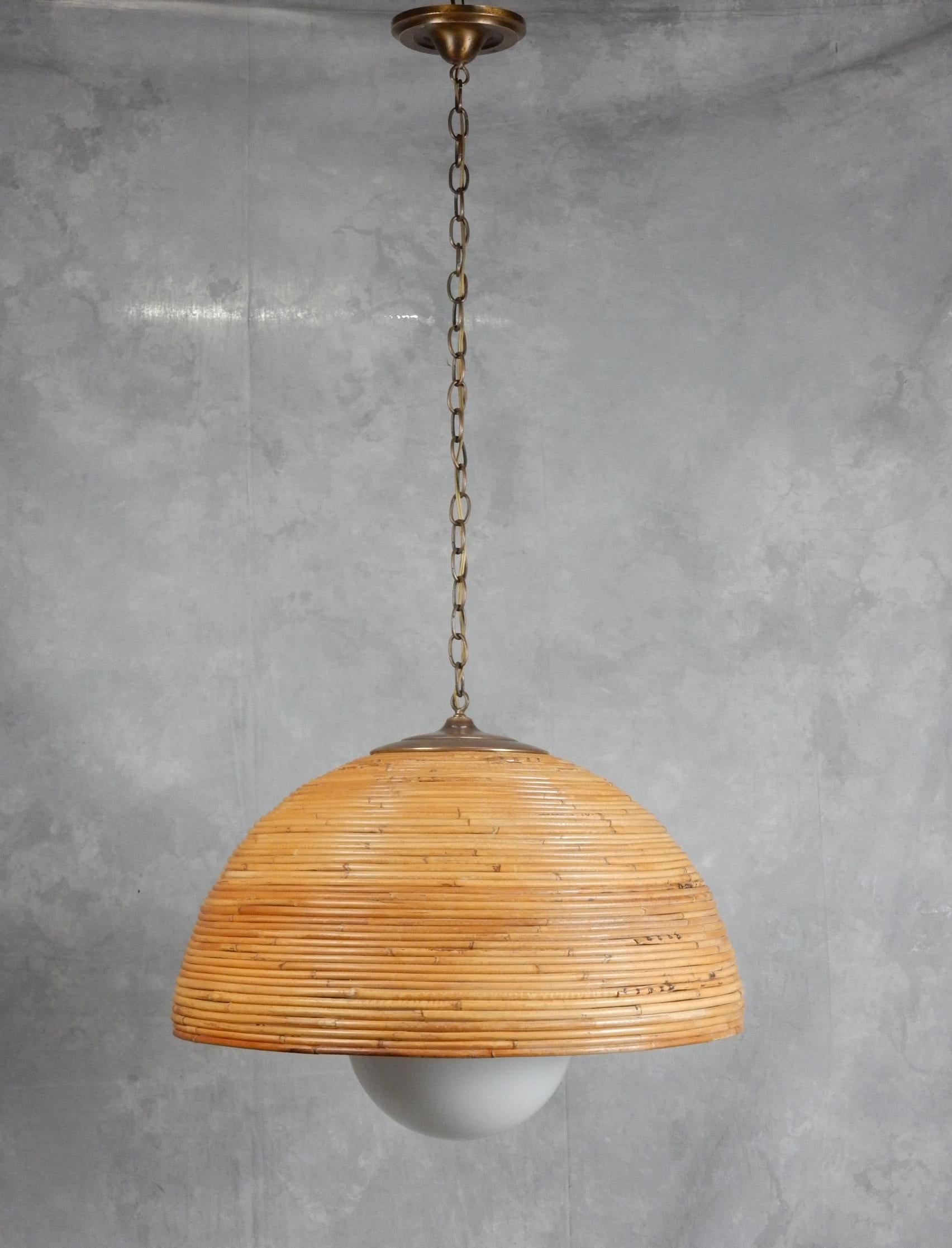 Large pencil reed dome shade pendant lamp from the 1960's.
Gorgeous aged brass hardware. Warm aged patina on reed .
10