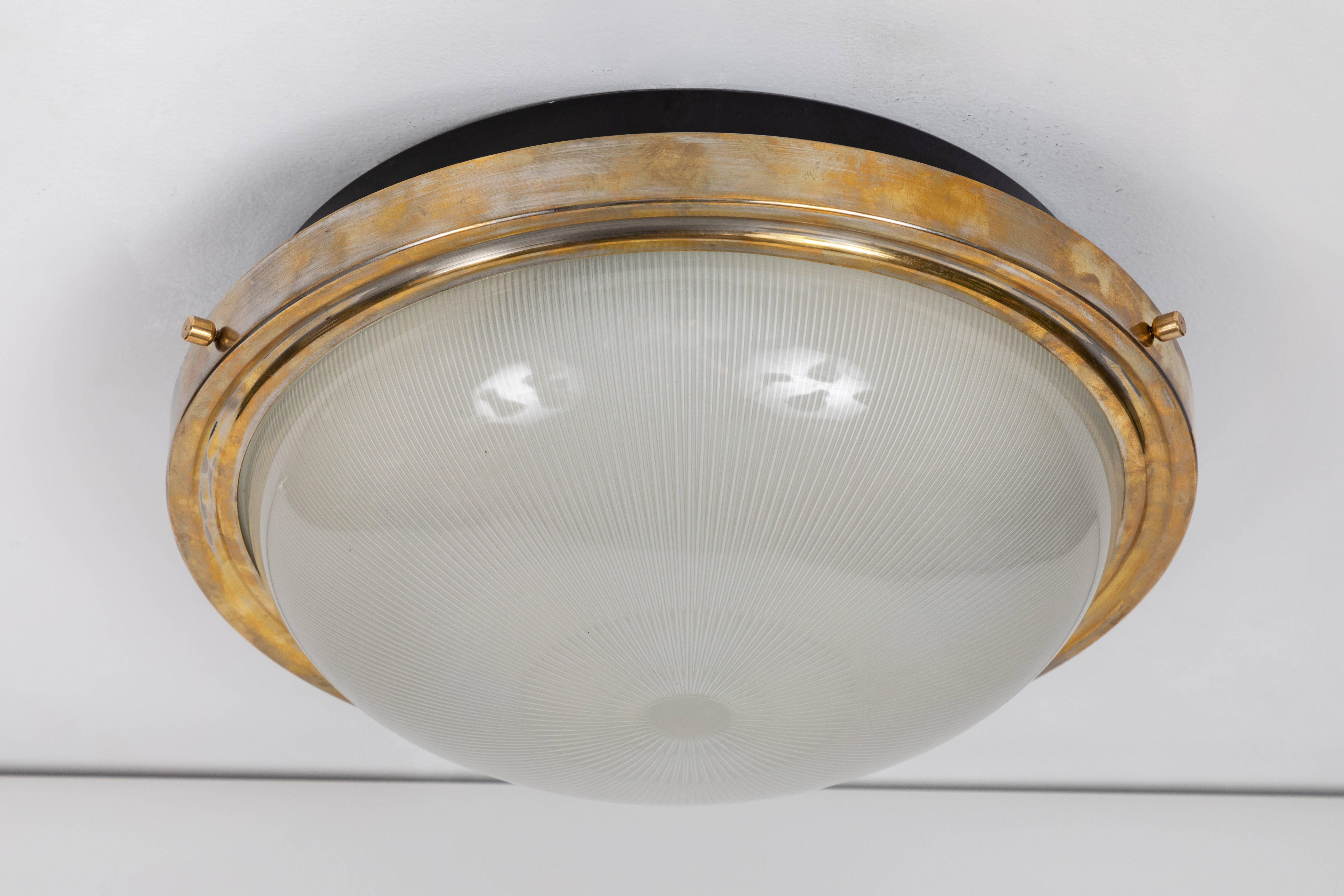 Large Sergio Mazza wall or ceiling light for Artemide, circa 1960s. This architectural and Minimalist designed light an be used as a flush mount or sconce. Executed in black metal, brass and pressed glass.
 