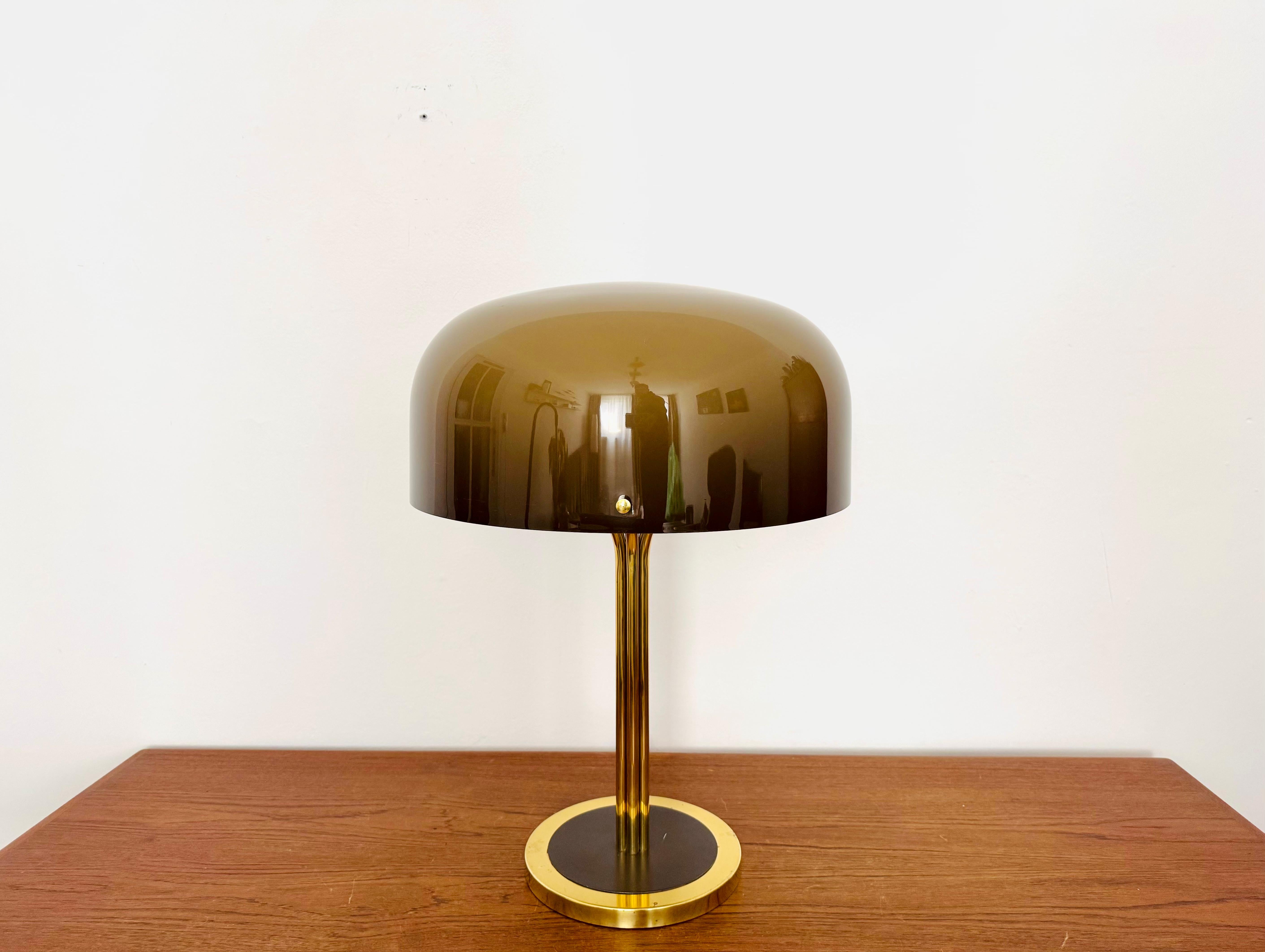 Large and beautiful table lamp from the 1960s.
Impressive design and very high-quality workmanship.
The brown plastic lampshade makes the lighting effect extremely beautiful.

Condition:

Very good vintage condition with slight signs of wear and