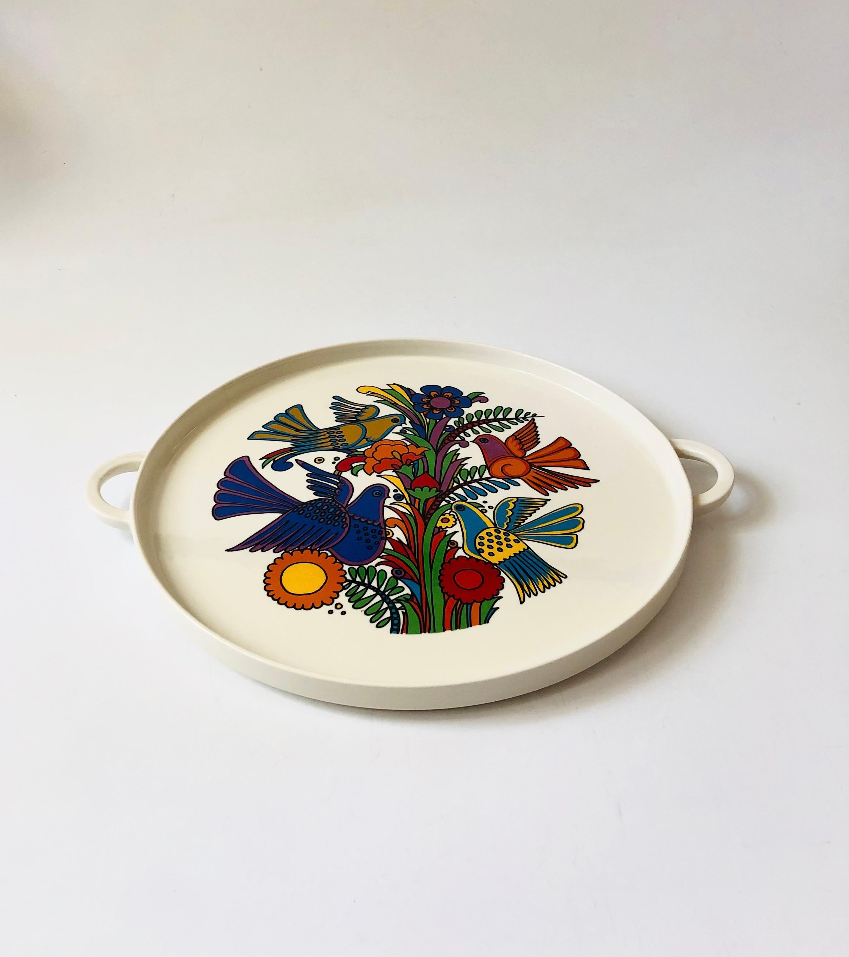 An extra large vintage ceramic serving tray from the 1960s. Features a colorful design of flowers and birds in the center in the Acapulco pattern designed by Christine Reuter. Two handles are formed on the sides. Produced in Luxembourg by Villeroy
