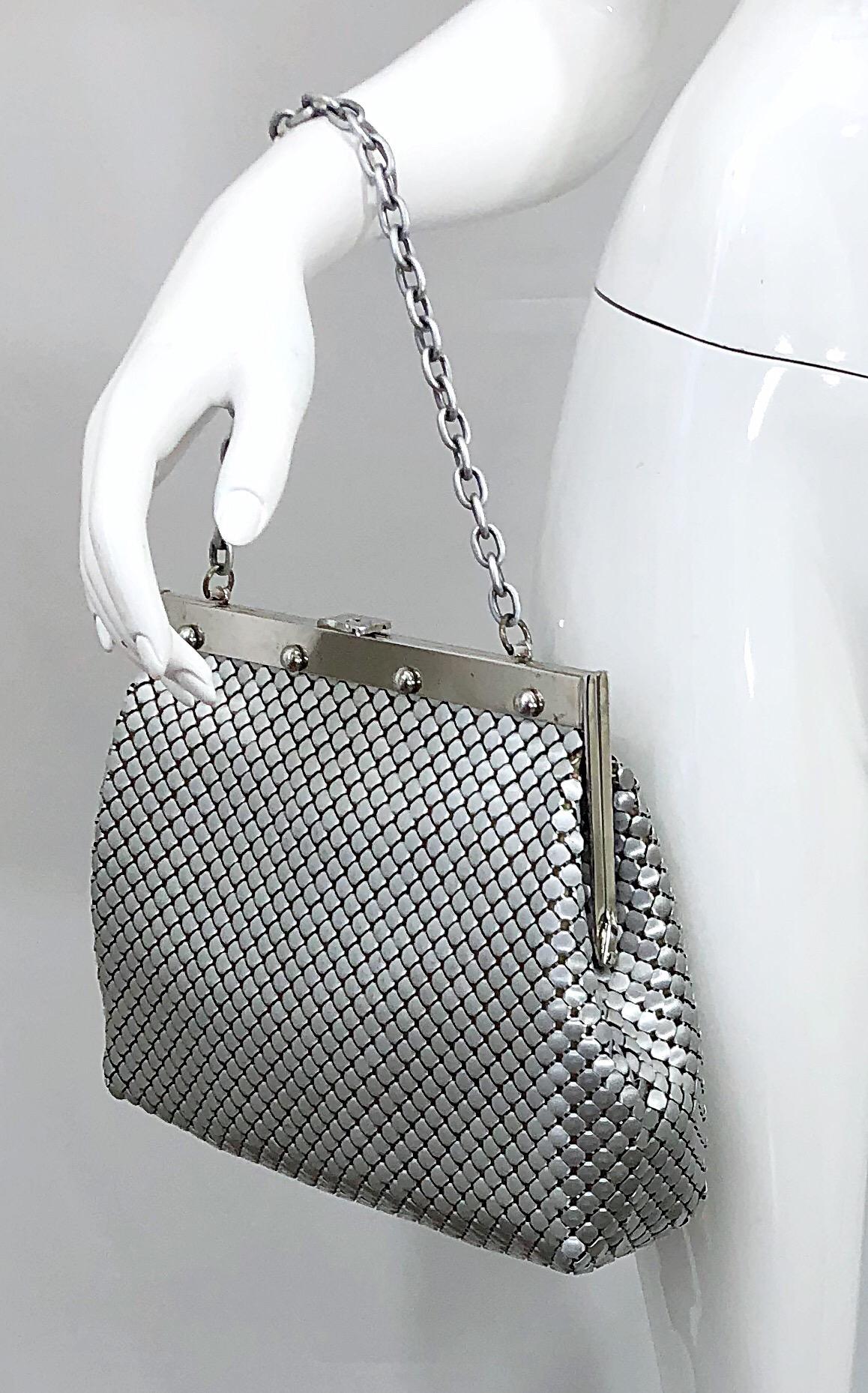 Chic and rare large silver / nickel 1960s WHITING AND DAVIS chain mail metal bag! Features clasp closure and chain strap. Light rayon interior makes it easy to find items. One single pocket. Can be worn either as a handbag or shoulder bag. Fits all