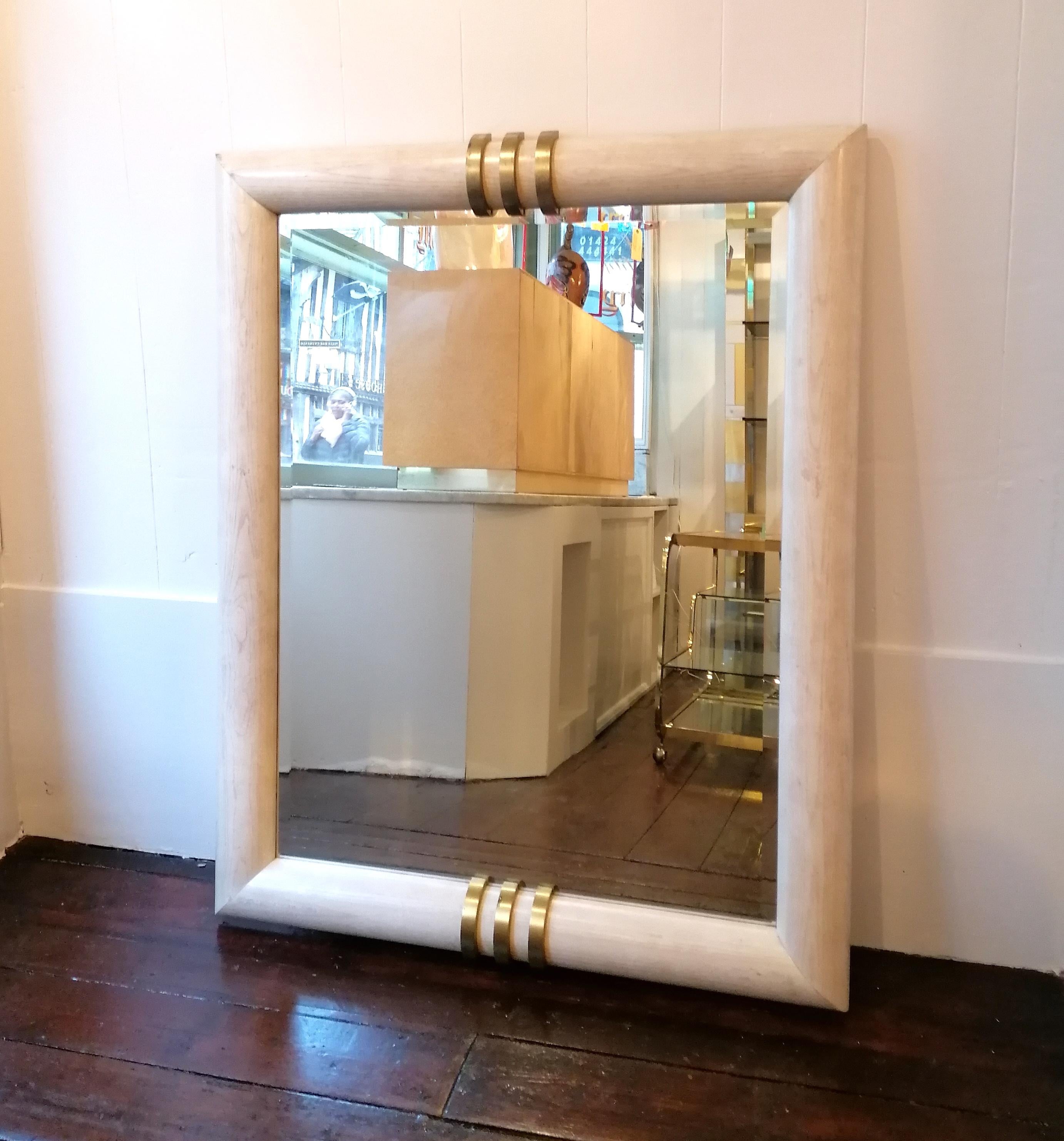 Large 1970s American mirror by Henredon. Whitewashed oak with chunky gilt brass details, bevelled mirror glass. Can be floor standing or wall hanging (there's a hanging batten on the back)

Dimensions: height 140.5cm, width 111.5cm, depth 8cm