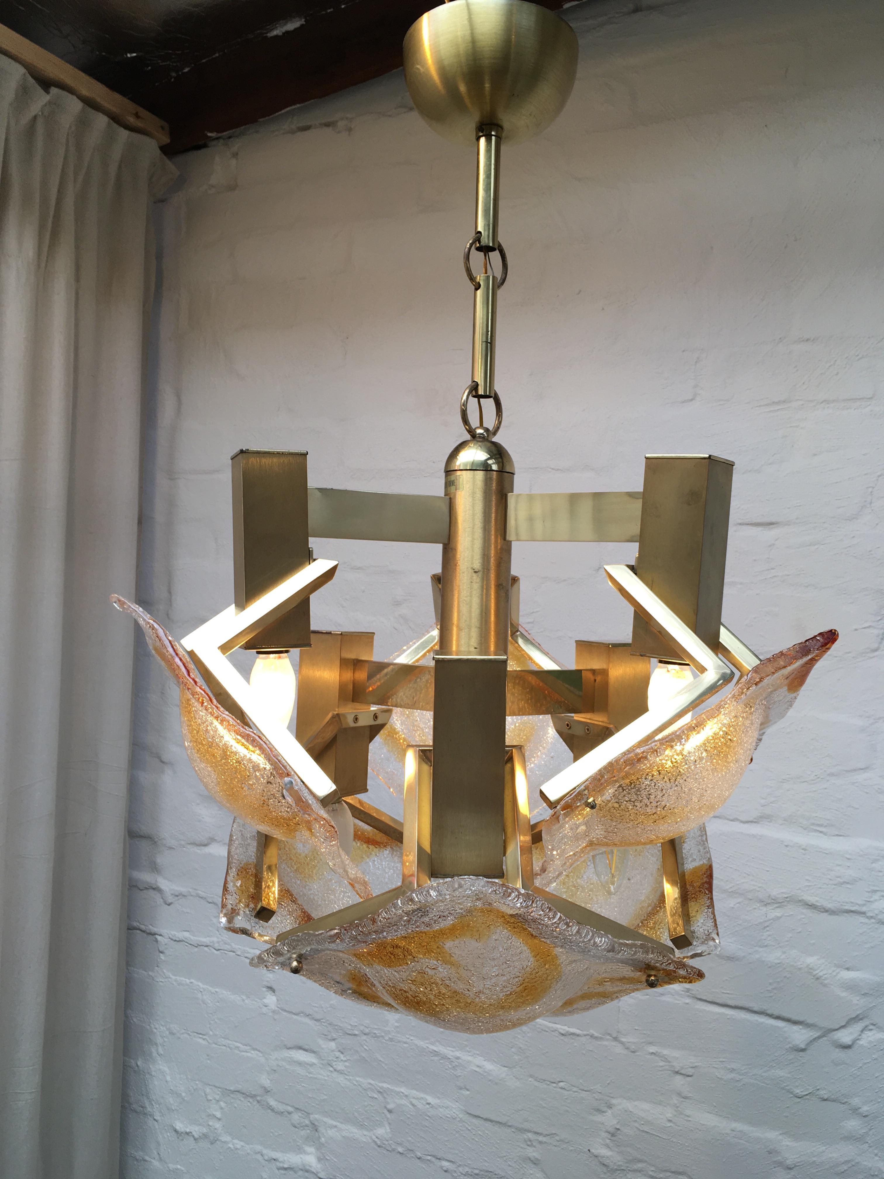 An impressive, angular, large 1970s chandelier in the Brutalist style. 

Produced by Nucleo Forme (trans. 'Core Forms'), an Italian lighting company we are sure to hear more about in the coming years. We think they may have been a manufacturer of