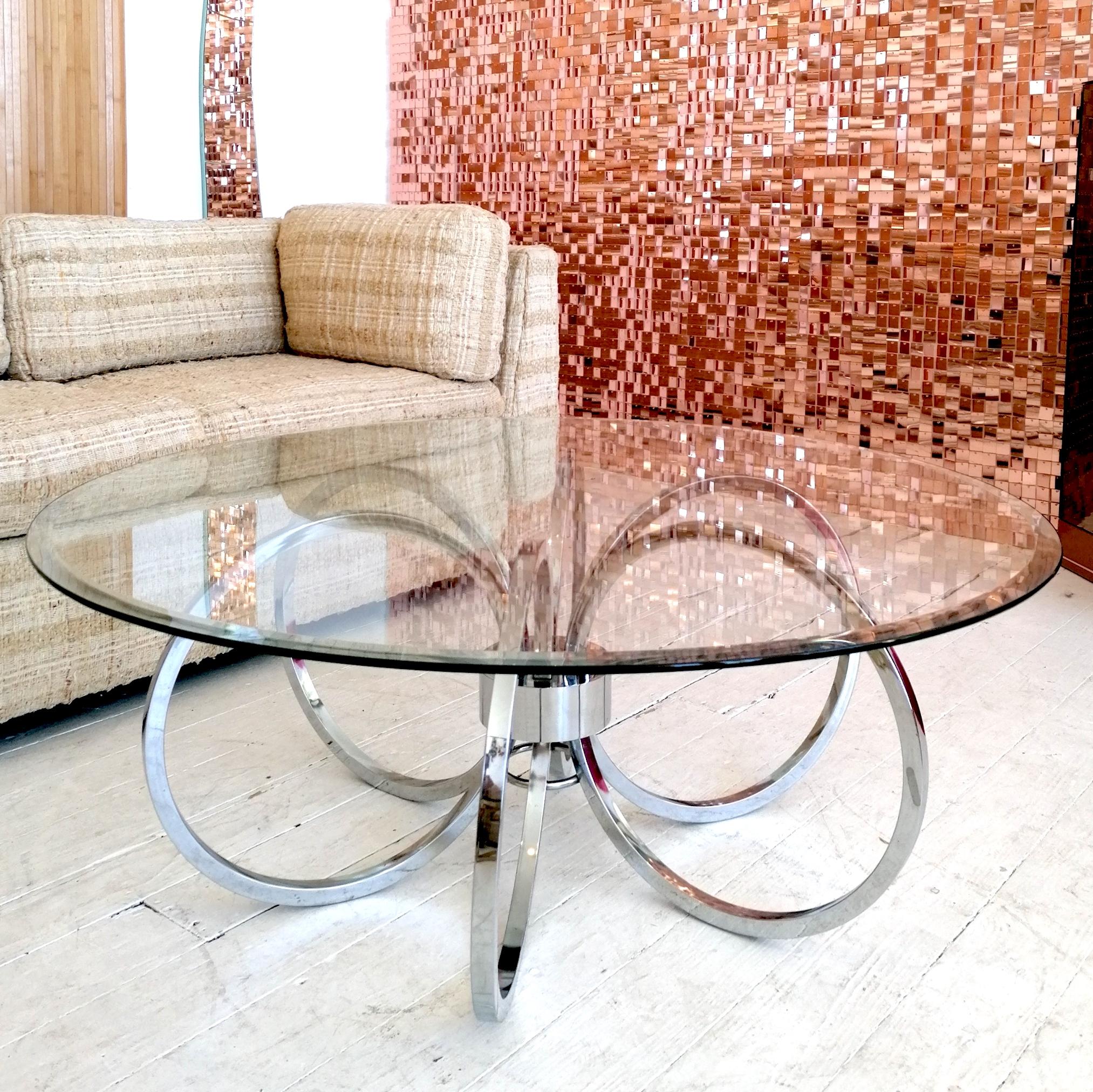 Stylish large Milo Baughman for Design Institute Of America attributed (no label) chrome rings coffee table with bevelled glass top.
USA, 1970s.
In great condition.