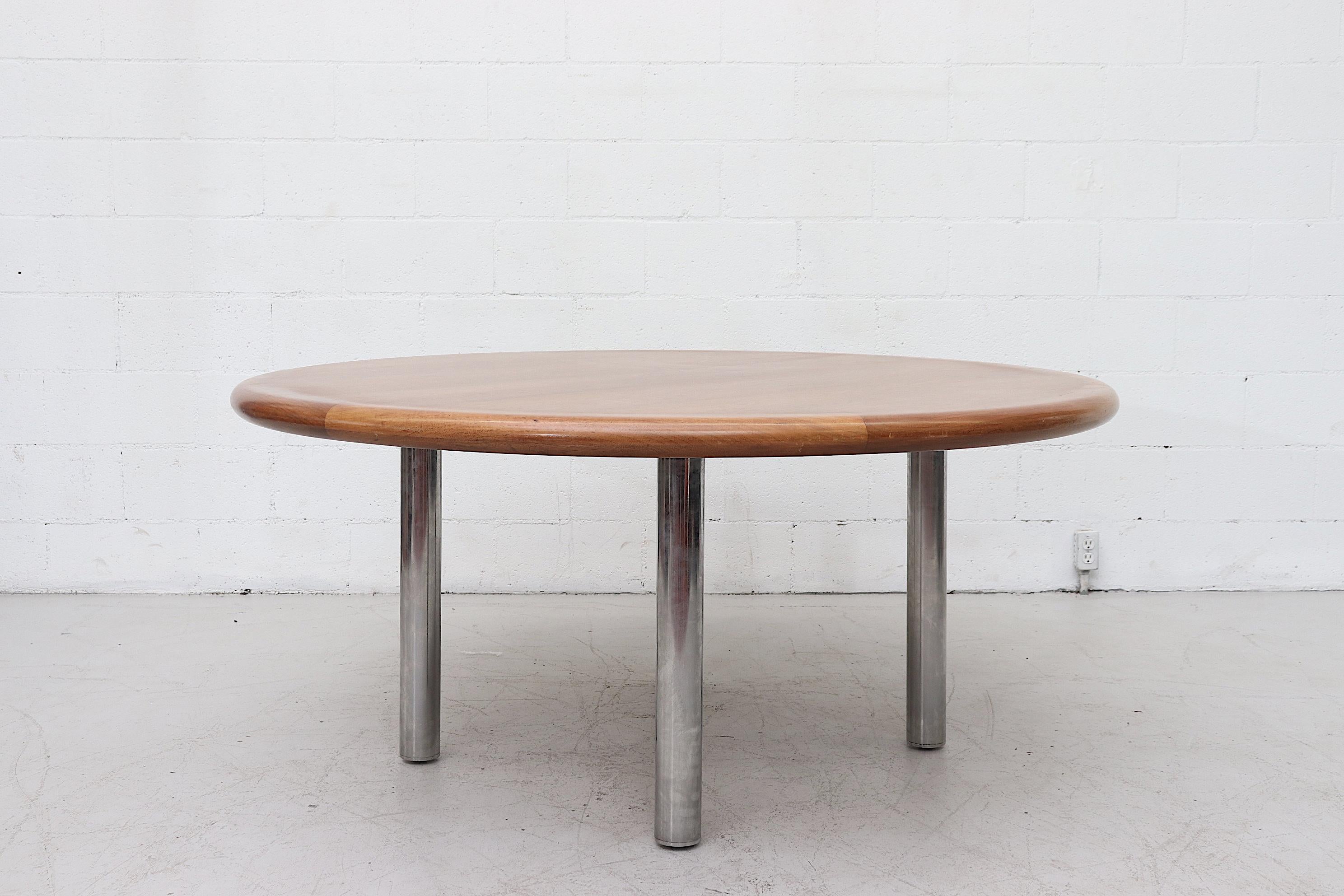 Large 1970s custom dining or conference attributed to Knoll. Extremely heavy bull-nosed solid wood top with fat tubular chrome legs. Custom made conference table for 6 Pollack rolling office chairs in the late 1970s. Previous owner had moved