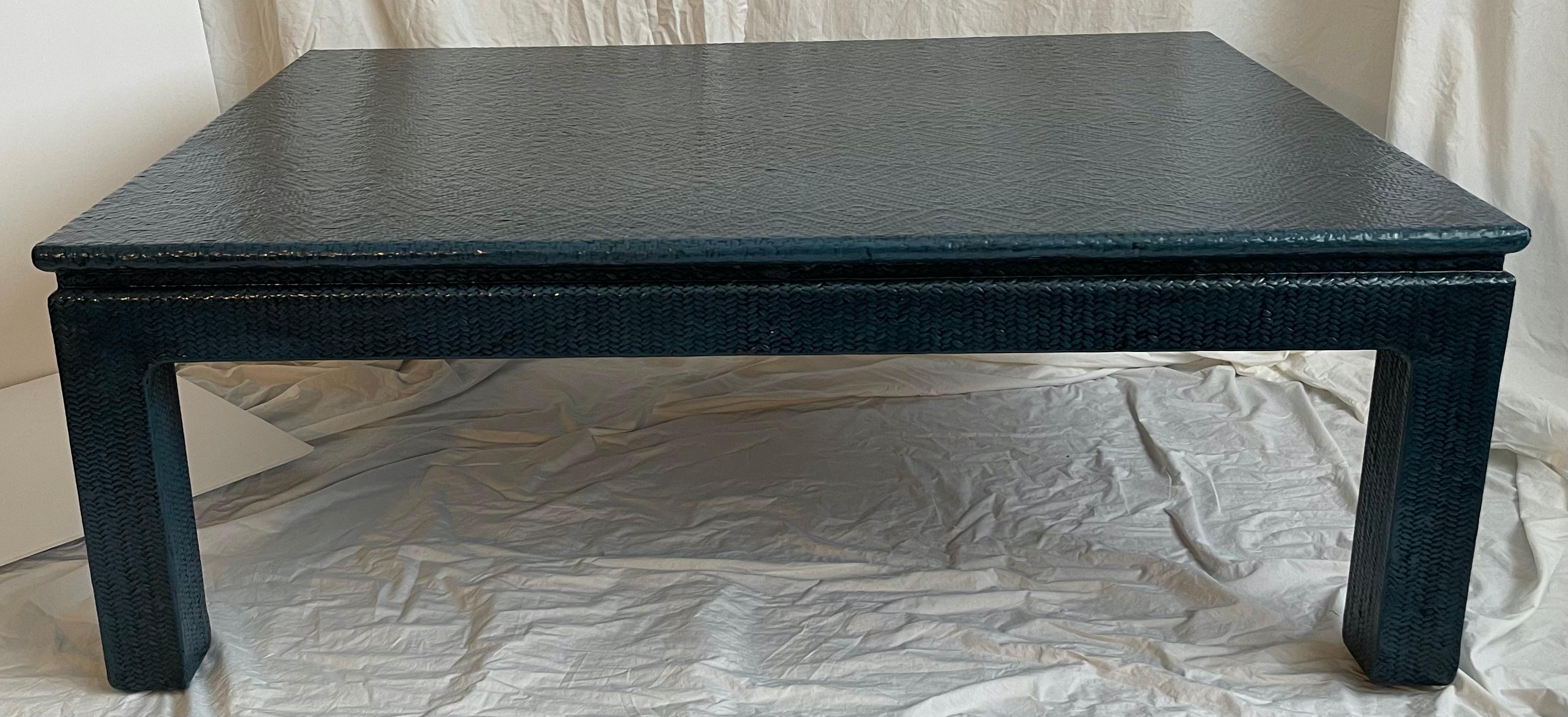Large 1970s dark blue painted grasscloth cocktail table.
Chinoiserie style cocktail table wrapped in diamond pattern grasscloth. Newly re-painted in a custom medium blue with black antique finish.
No makers mark or signature, in the style of Karl