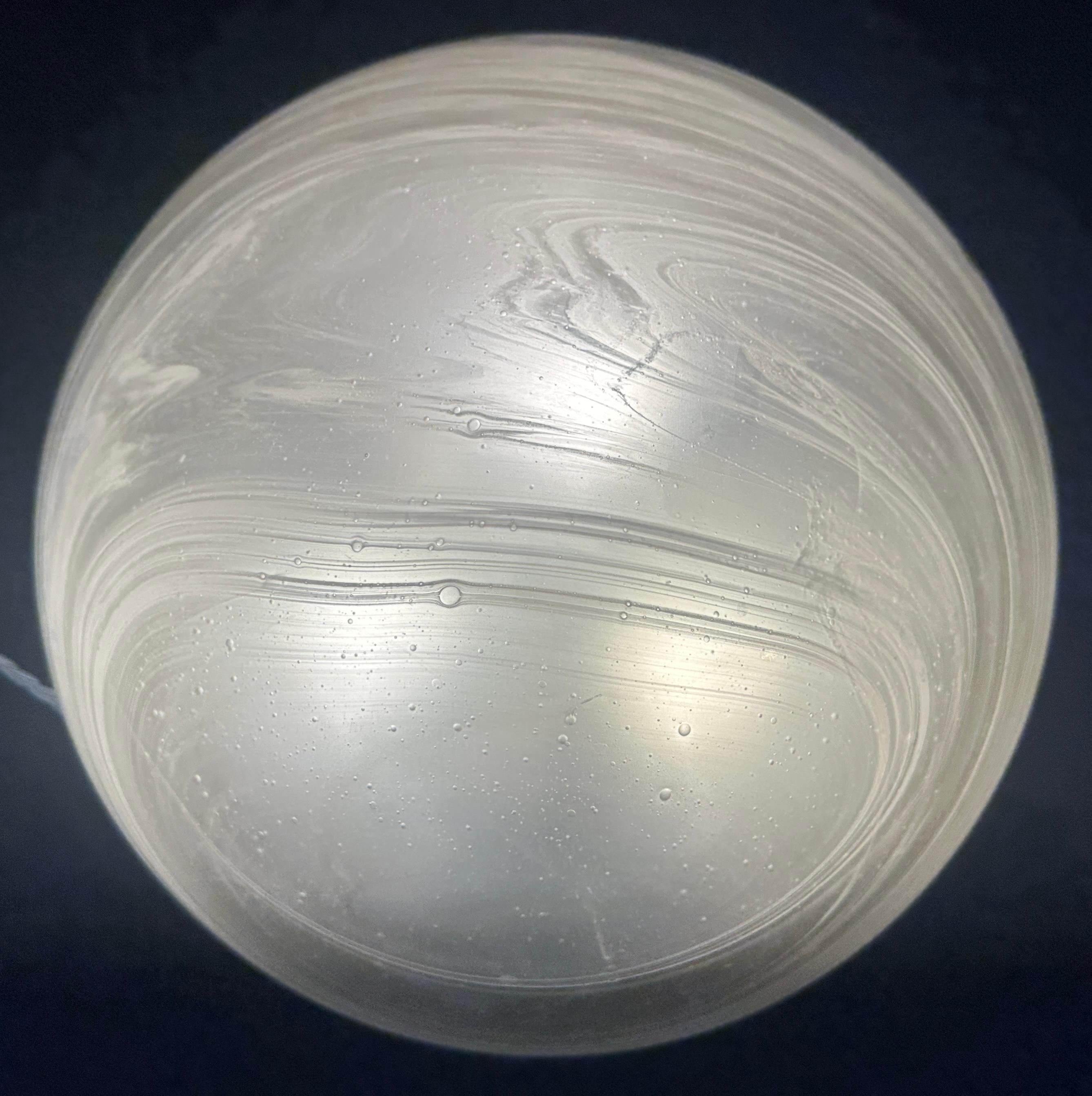 A large Mid Century Modern 1970s German Peill & Putzler domed frosted glass ceiling flush mount ceiling light.  The frosted cloud-like white swirls around the grey tinted glass are similar to those around the Galaxy and the planet Saturn.  The