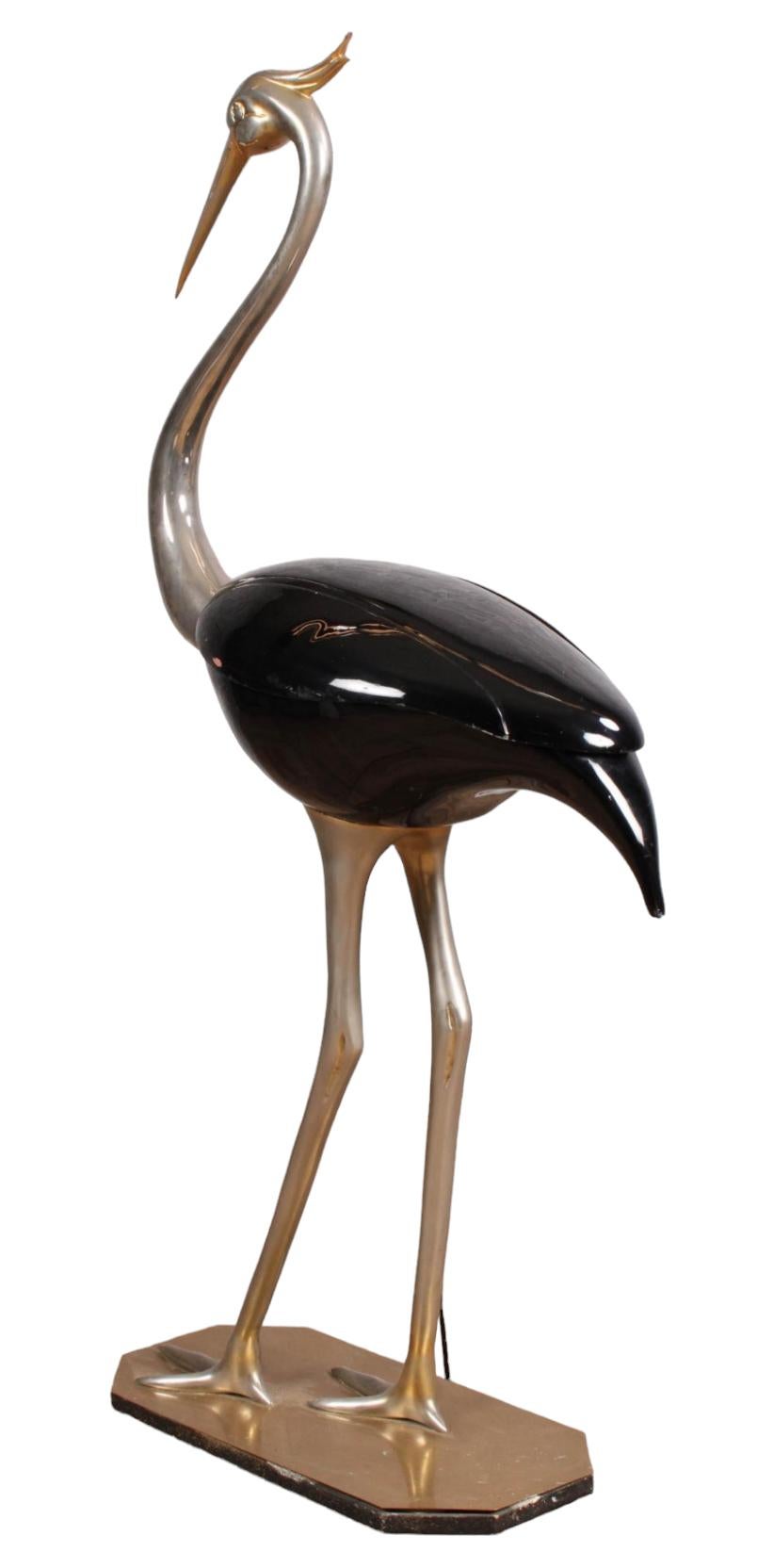 Rare Fondica metal and enamel crane sculpture made in France during the 1970s. The storage compartment in the body of the crane adds to the interest of this piece. For the majestic crane lover or the quirky decor enthusiast. Bears the signature of