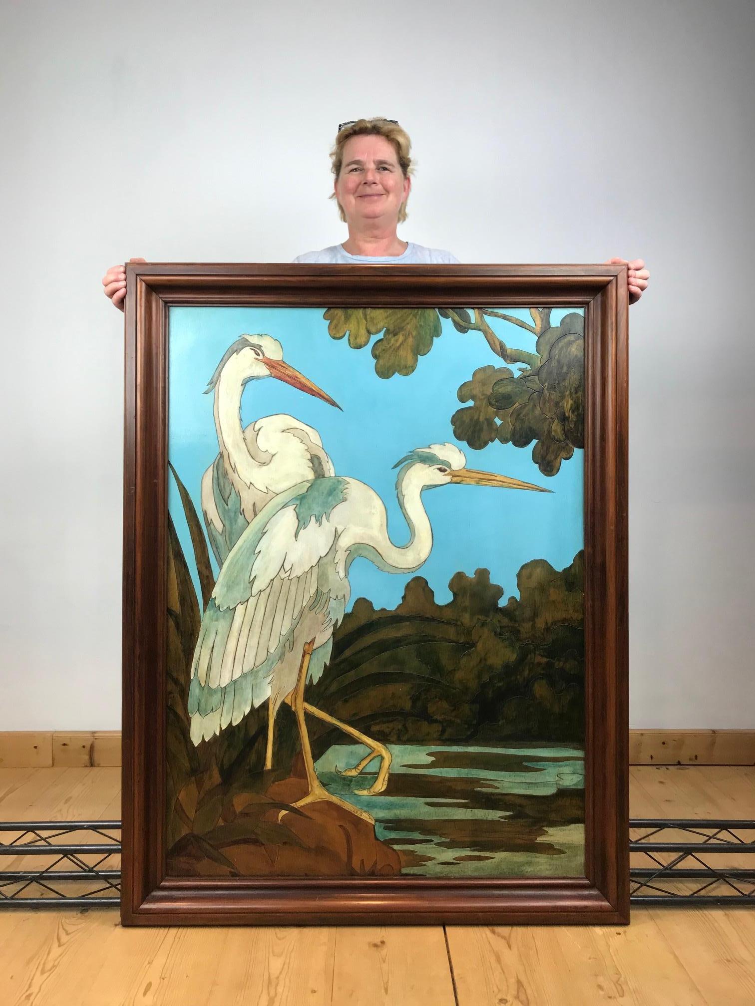 Stunning Large Painting with Heron Birds or Asian Crane Birds on Wood.  
This eye-catching painting with great colors dates circa 1970s. 
The water birds are standing next to the water surrounded with trees and nature. 
Awesome use of the bright