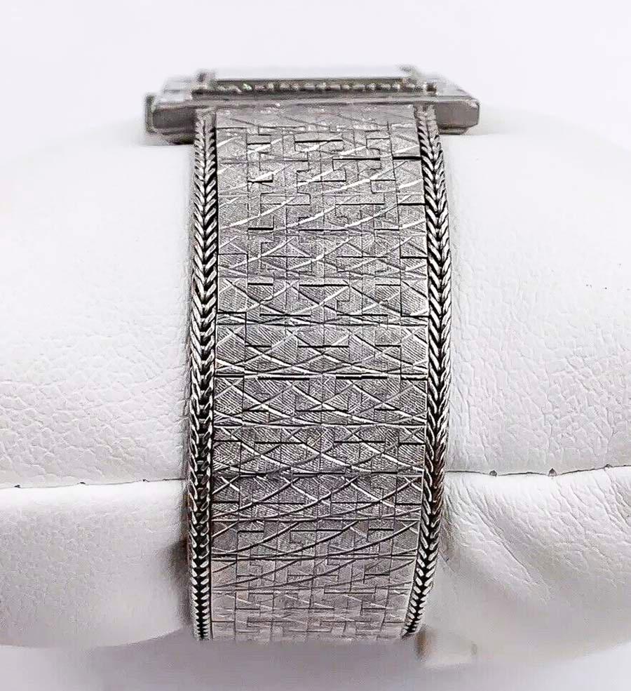 Women's or Men's Large 1970s Piaget 18kt Double Diamond Row Roman Numeral Textured Bracelet Watch For Sale