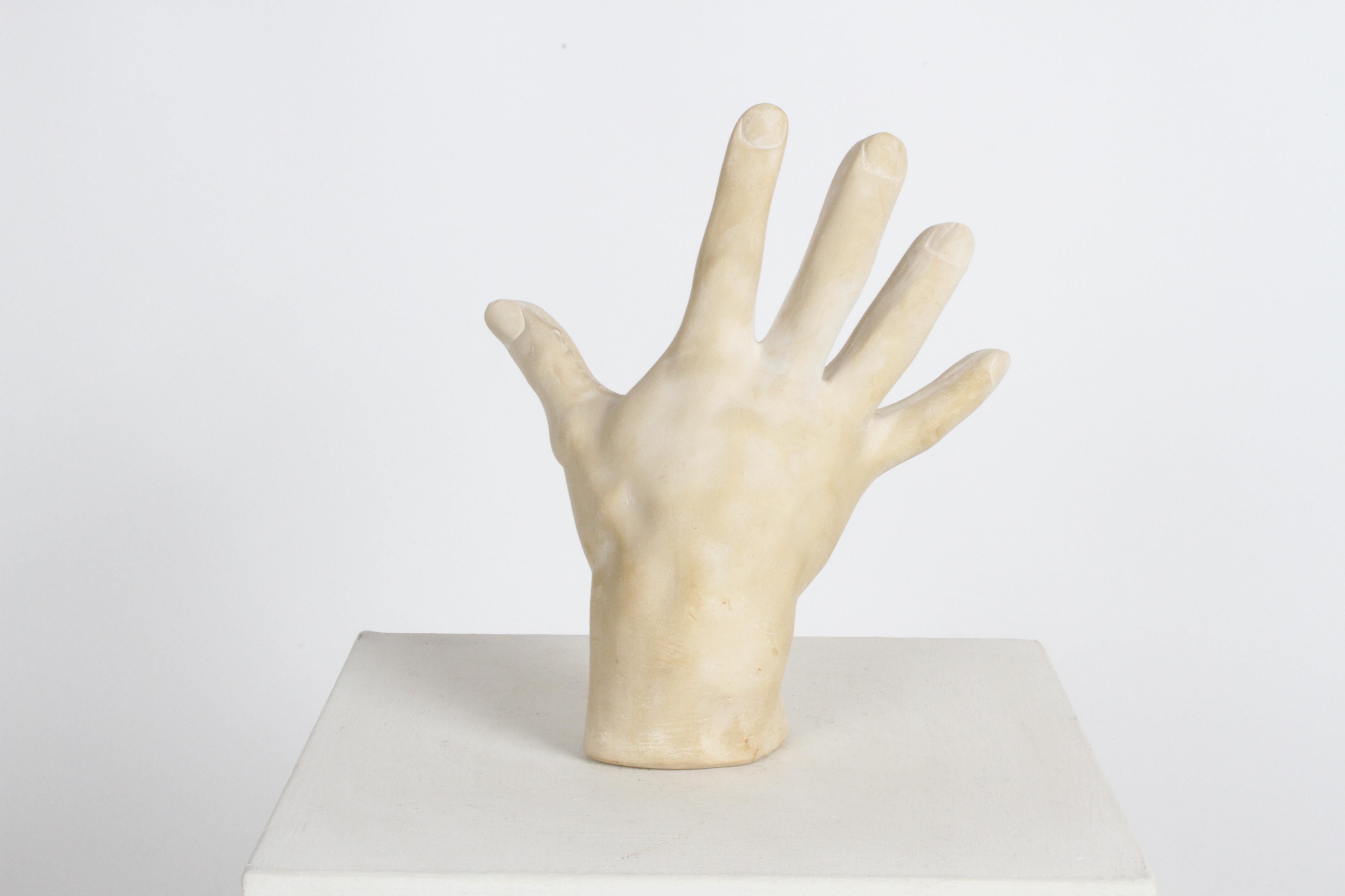 Larger than life 1970s cast plaster hand sculpture, possible artist or hand study, in the style of John Dickinson.
Plaster has slight tan wash over the white plaster. No breaks or damage noted.