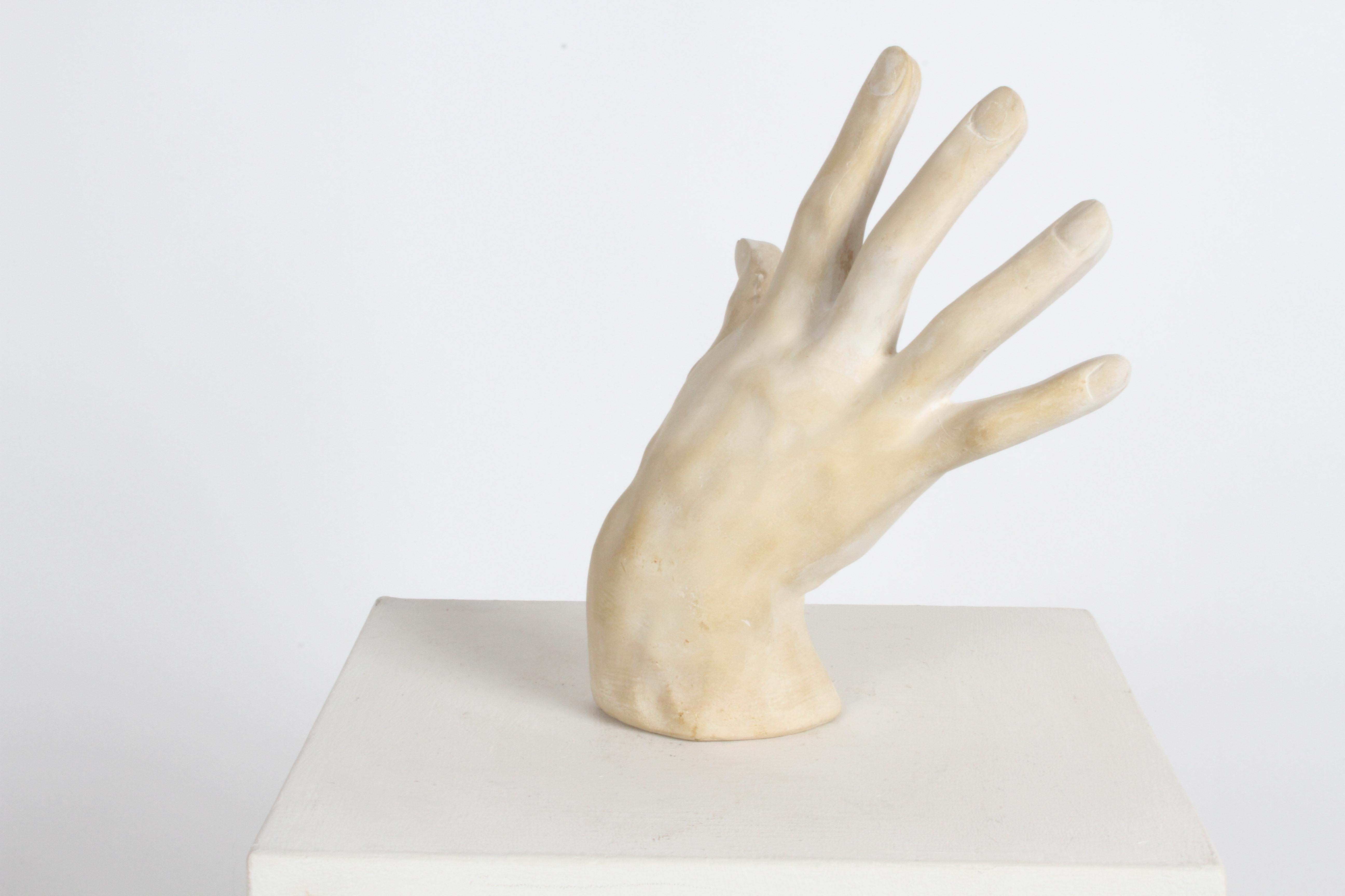 plaster hand sculpture