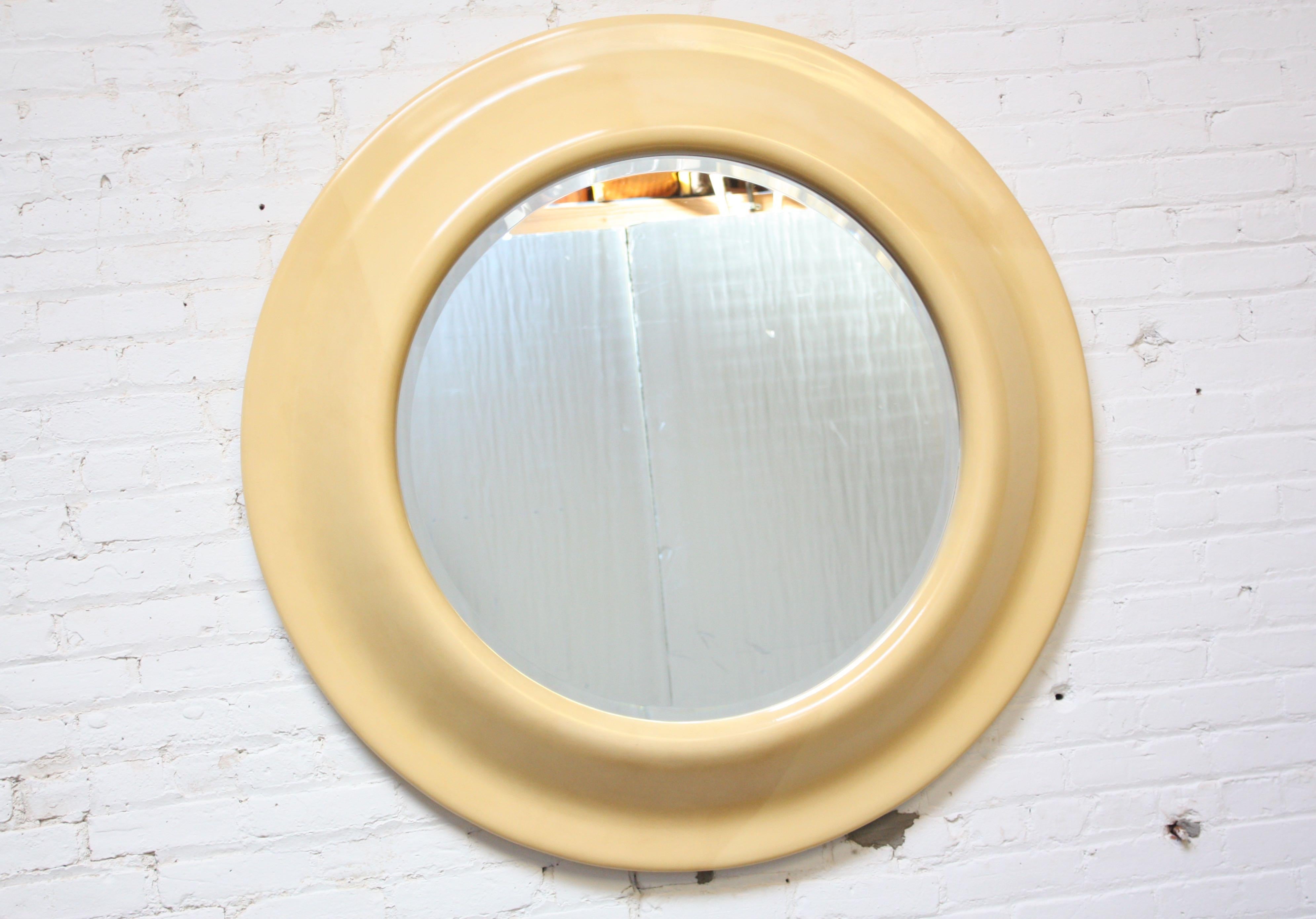 Striking round mirror with goatskin parchment veneered resin frame. Mirror itself has beveled border. Excellent shape with only few, minor impressions to the frame. 
46.5