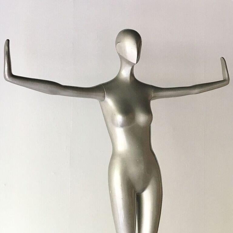 Large 1970s silver painted 'vogueing' fibreglass female mannequin USA. 

Perfect for draping the days clothes and jewelry in a dressing room or displaying your favorites’ of the season!
 
