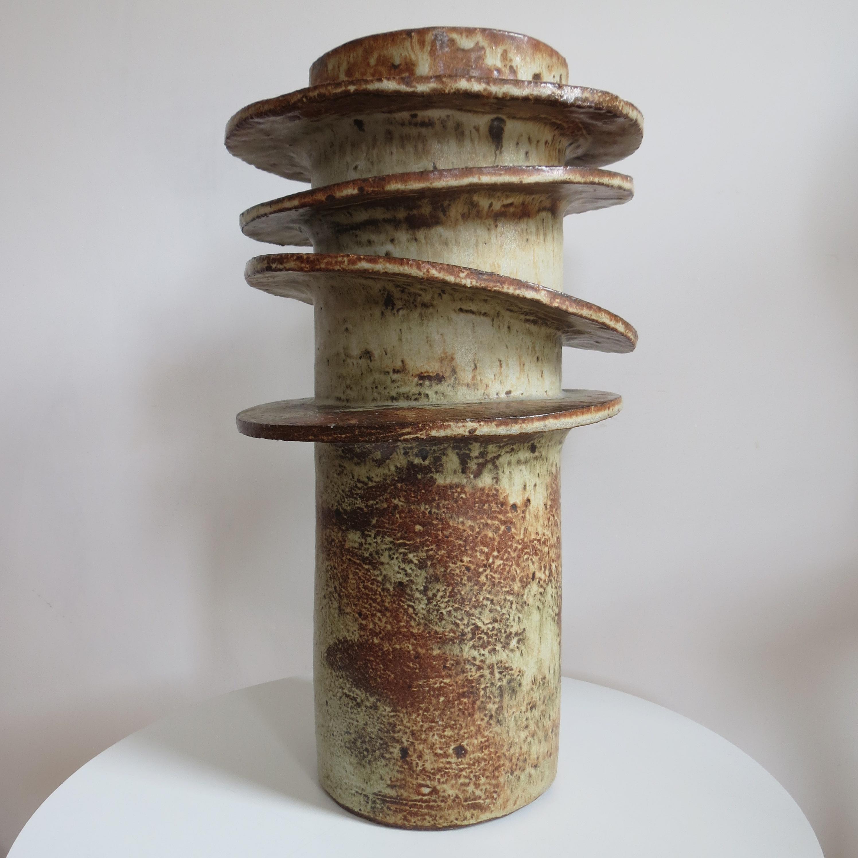 Very large studio pottery sculptural vase by Maggie Fisher. Produced in Cornwall, UK. 
Cylindrical form vase with circular rings to the outside. Signed to the underside MF 1979.
A very good quality, heavy piece in good condition. 

Size 44cm