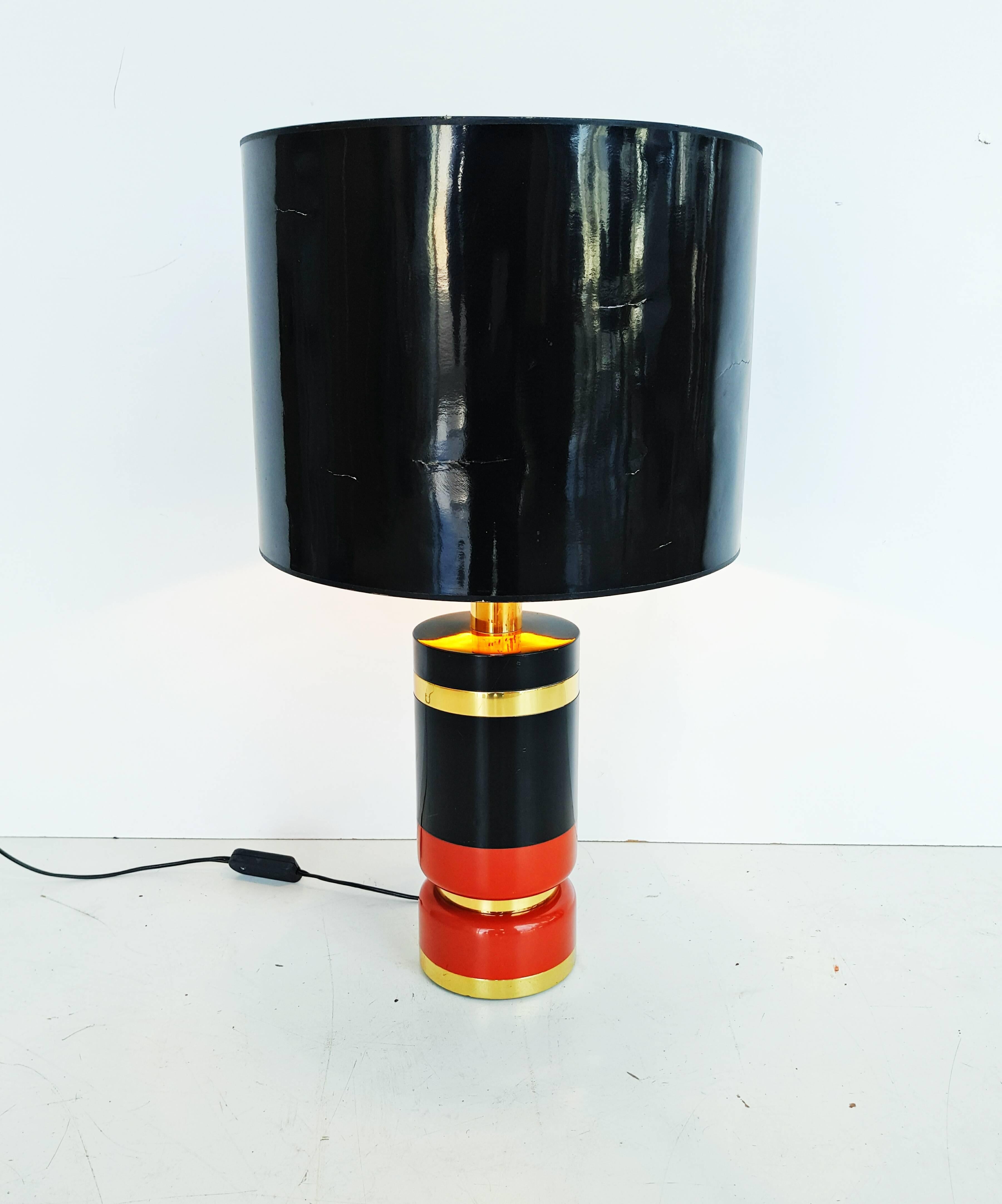 Beautiful and rare black and burgundy lacquered brass table lamp manufactured in Italy in 1970s. The lampshade is not included.