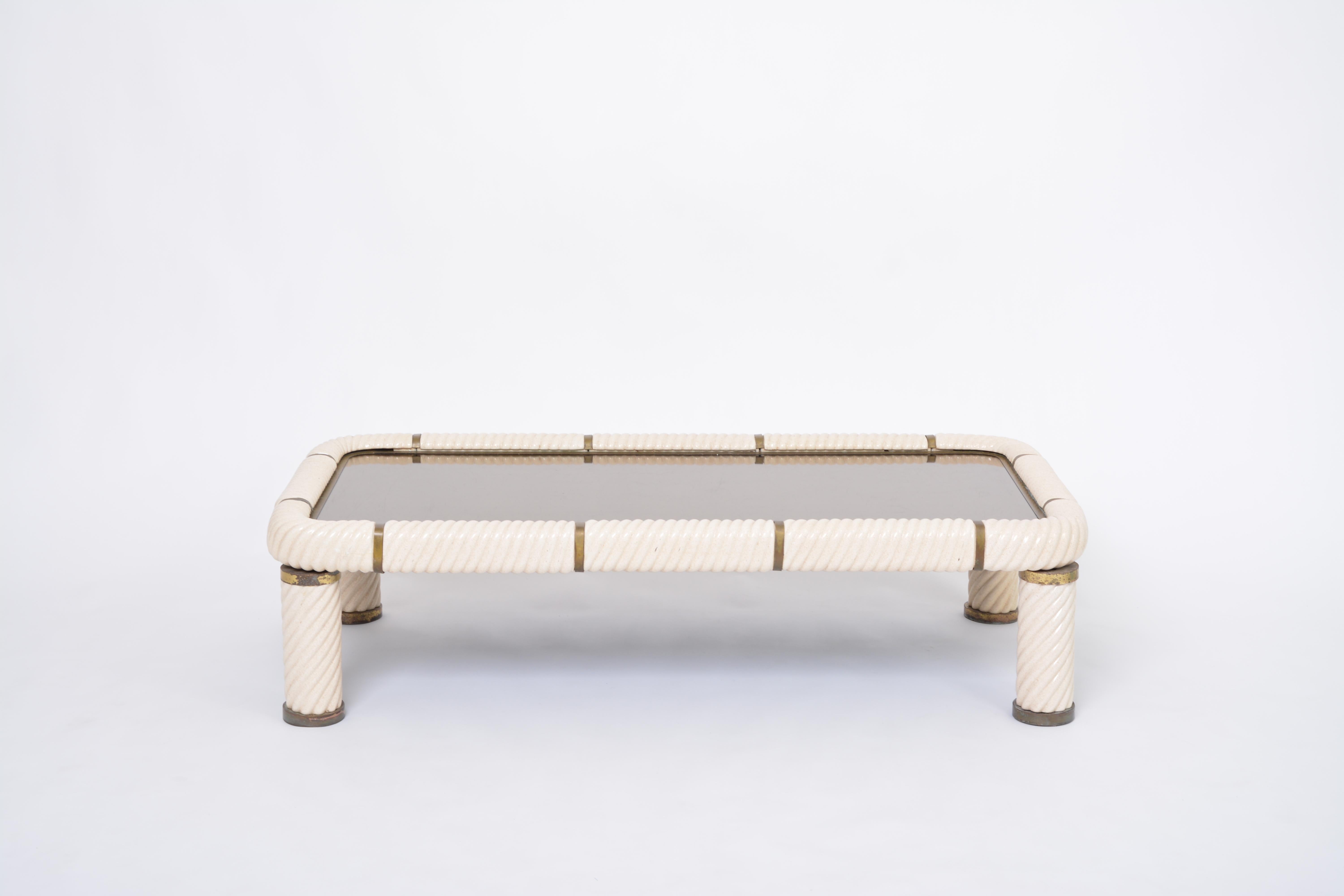 Large 1970s Tommaso Barbi white ceramic and brass coffee table
Stunning coffee table designed by Tommaso Barbi. This table features one of Barbi's signature techniques, which is porcelain in a spiral form to give this table it's absolute stunning